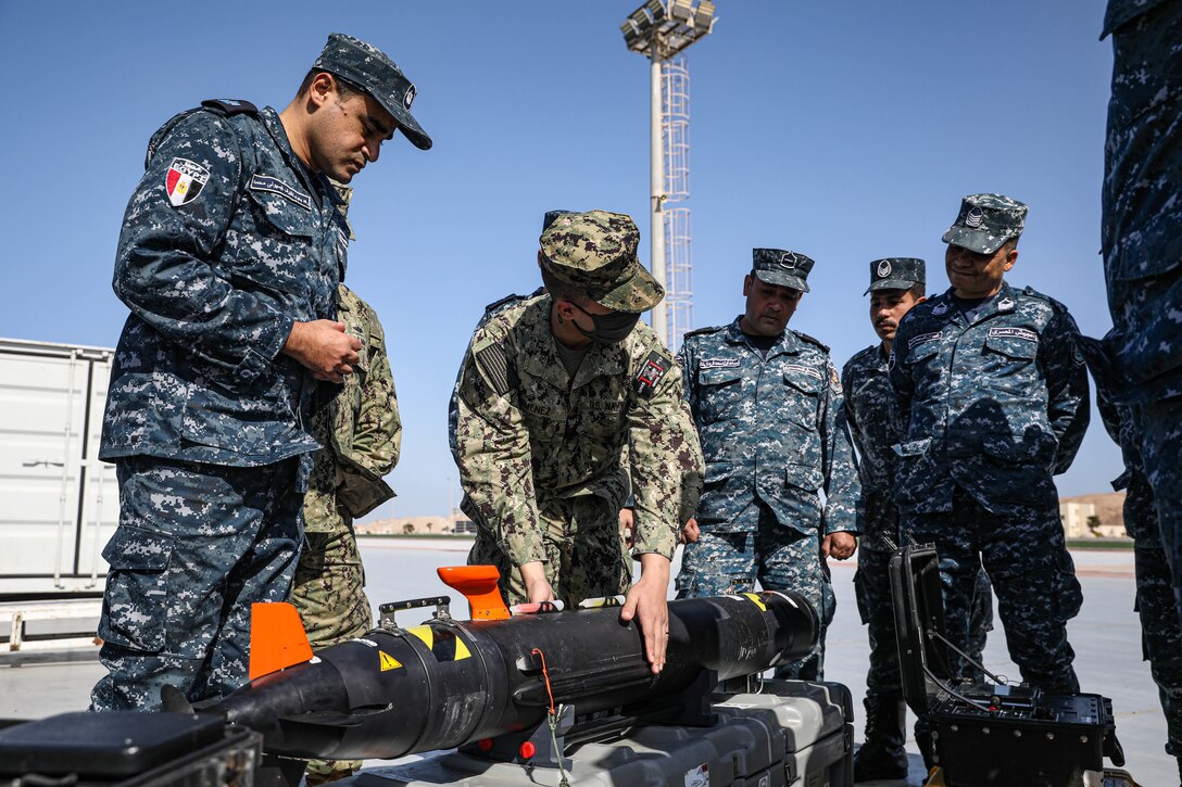 BERENICE, Egypt (Feb. 8, 2022) U.S. Navy Aerographer’s Mate 2nd Class Cristian Jimenez demonstrates an MK 18 Mod 1 (REMUS 100) unmanned underwater vehicle with Egyptian naval partners at Egypt’s Berenice Naval Base, Egypt, Feb. 8, during International Maritime Exercise/Cutlass Express 2022. IMX/Cutlass Express 2022 is the largest multinational training event in the Middle East, involving more than 60 nations and international organizations committed to enhancing partnerships and interoperability to strengthen maritime security and stability. (U.S. Army photo by Sgt. David Resnick)