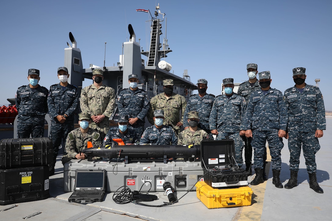 BERENICE, Egypt (Feb. 8, 2022) U.S. and Egyptian naval partners, working together during International Maritime Exercise/Cutlass Express 2022, pose for a group photo with the MK 18 Mod 1 (REMUS 100) unmanned underwater vehicle at Egypt’s Berenice Naval Base, Egypt, Feb. 8. IMX/Cutlass Express 2022 is the largest multinational training event in the Middle East, involving more than 60 nations and international organizations committed to enhancing partnerships and interoperability to strengthen maritime security and stability. (U.S. Army photo by Sgt. David Resnick)