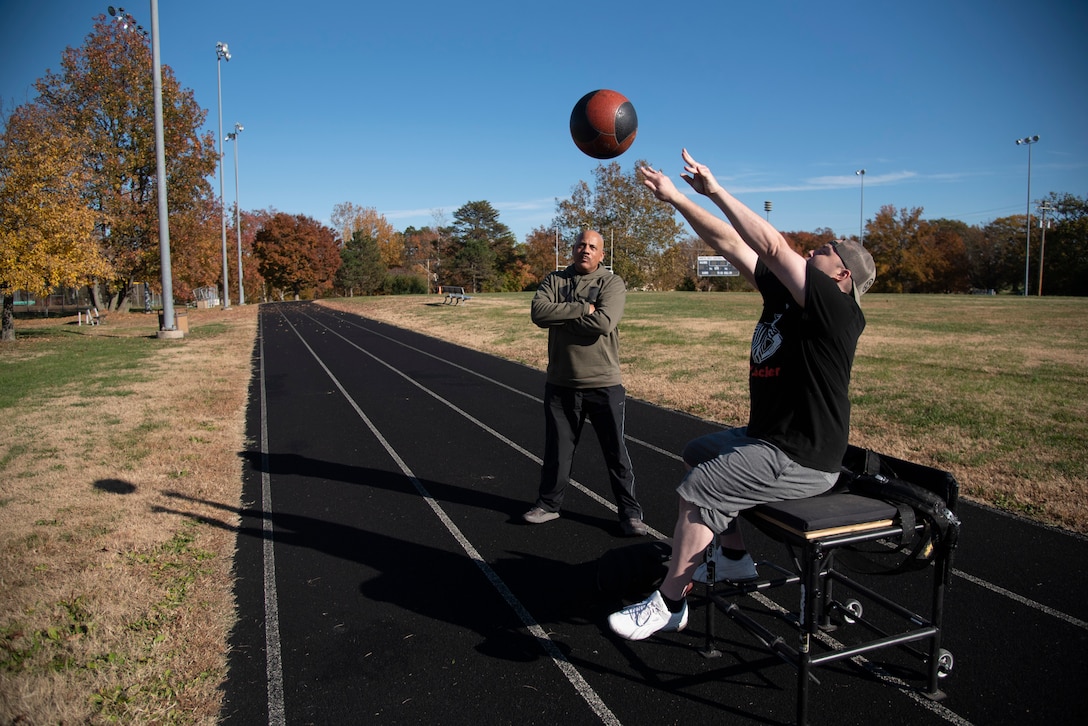 Wounded, ill and injured service members participate in a track and field clinic at Fort Belvoir, Virginia, on November 12, 2021.