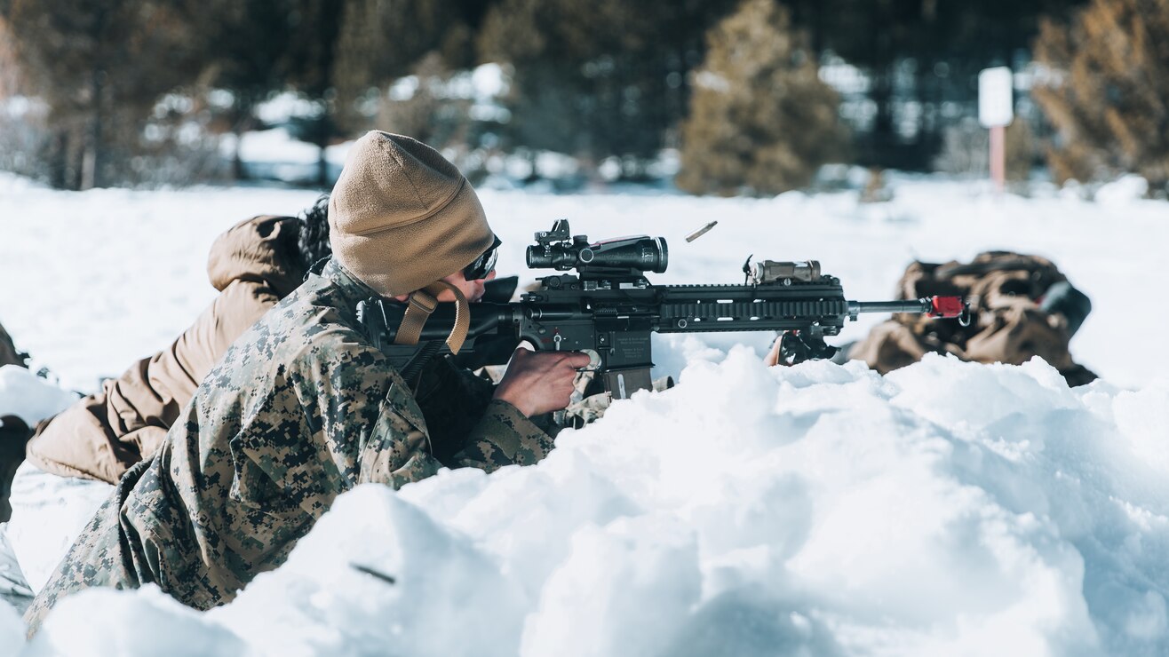 A U.S. Marine with 3d Battalion, 3d Marines, 3d Marine Division, engages targets while under contact at Mountain Warfare Training Center, Bridgeport, Calif., Feb. 1, 2022. Marines with 3/3 conducted Mountain Warfare Training Exercise 2-22, where they increased their combat lethality and readiness through a company-level force-on-force offensive lane.