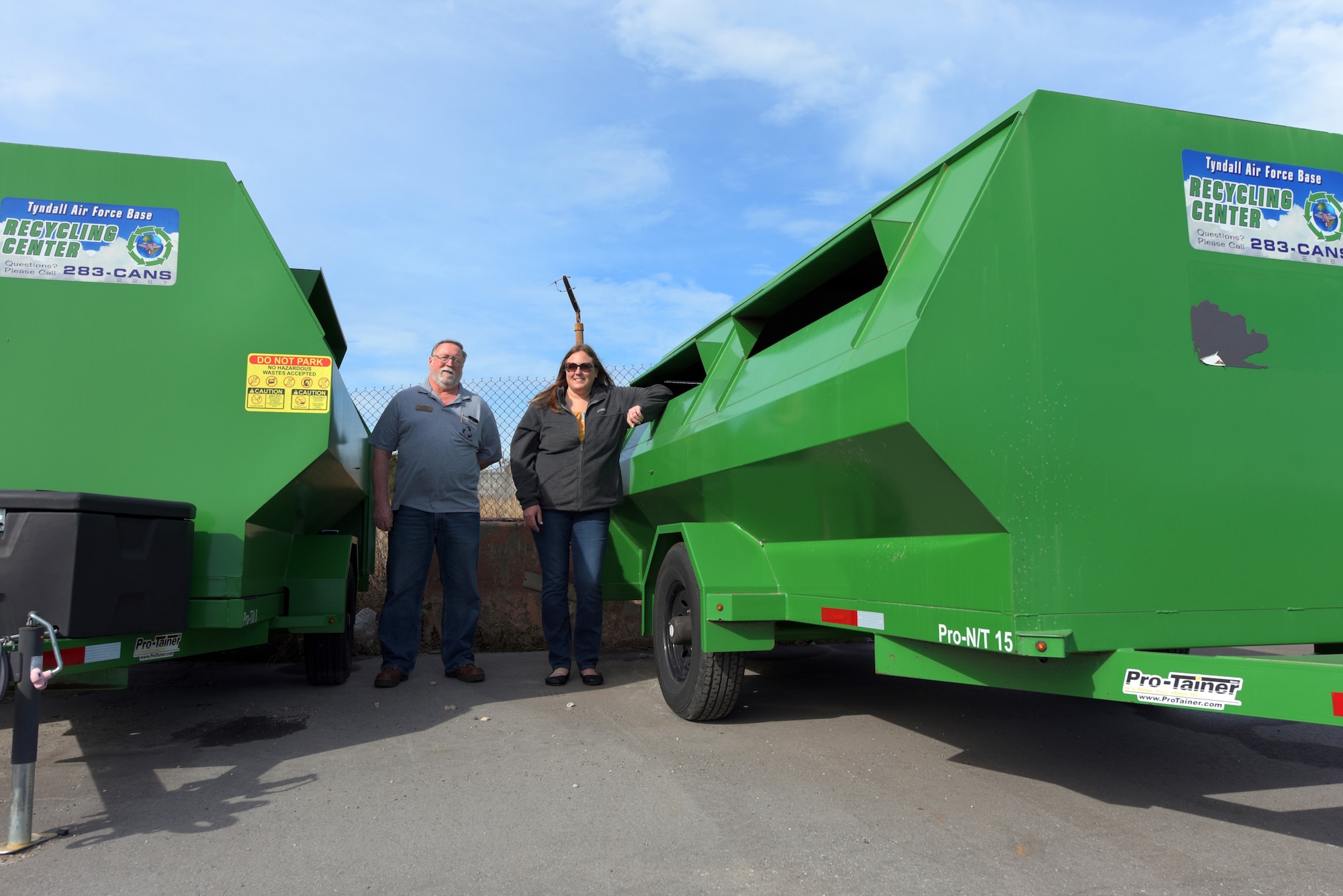 Recycling members next to collection containers