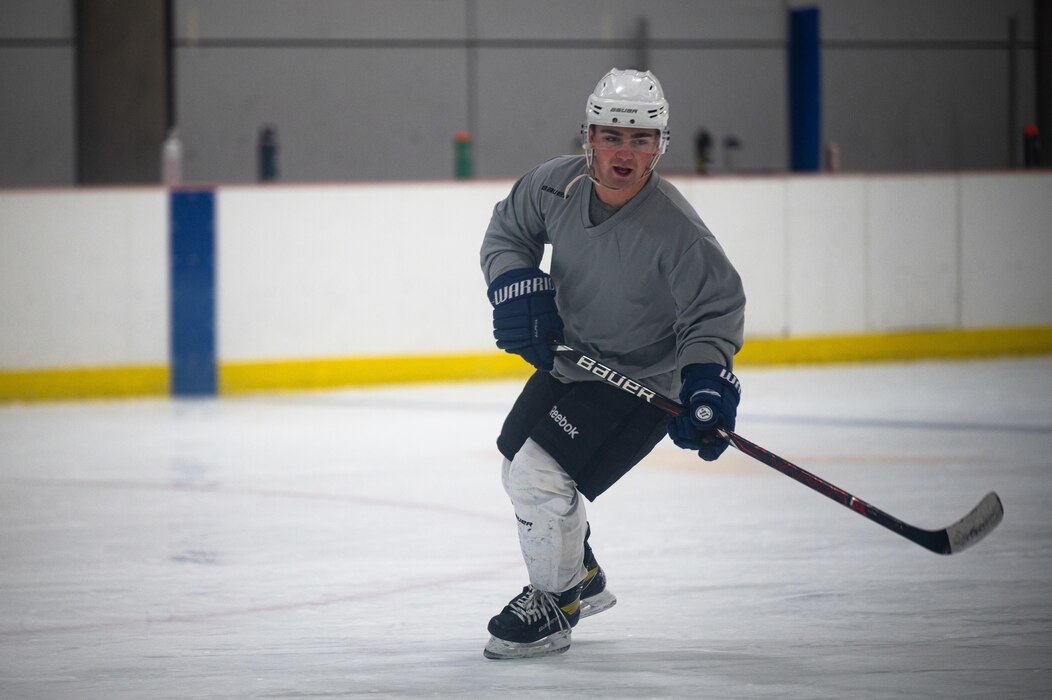 U.S. Air Force Senior Airman Adam Taylor, a 354th Contracting Squadron contract specialist, trains for an ice hockey game on Fort Wainwright, Alaska, Feb. 2, 2022.