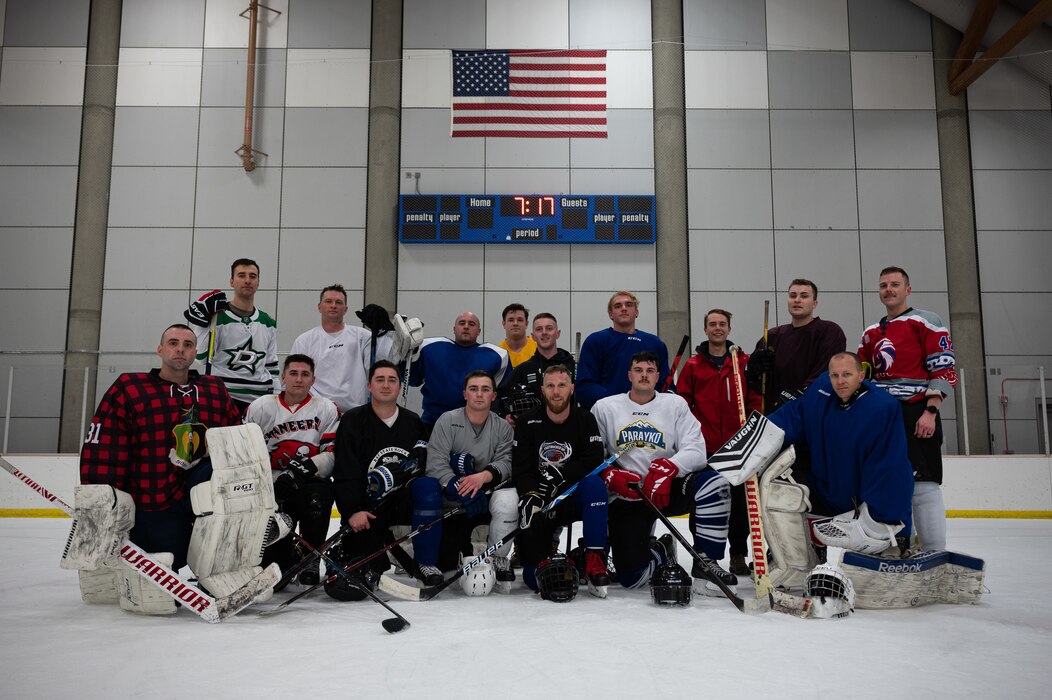 Members of the Eielson Hockey Team pose for a group photo on Fort Wainwright, Alaska, Feb. 2, 2022.