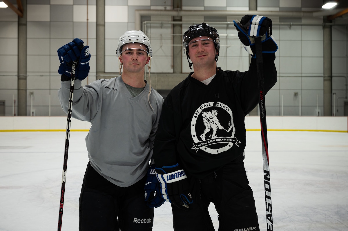 U.S. Air Force Senior Airman Adam Taylor, a 354th Contracting Squadron contract specialist (left), and Special Agent Jack Taylor, an Office of Special Investigations Detachment 632 investigator, pose for a photo on Fort Wainwright, Alaska, Feb. 2, 2022.