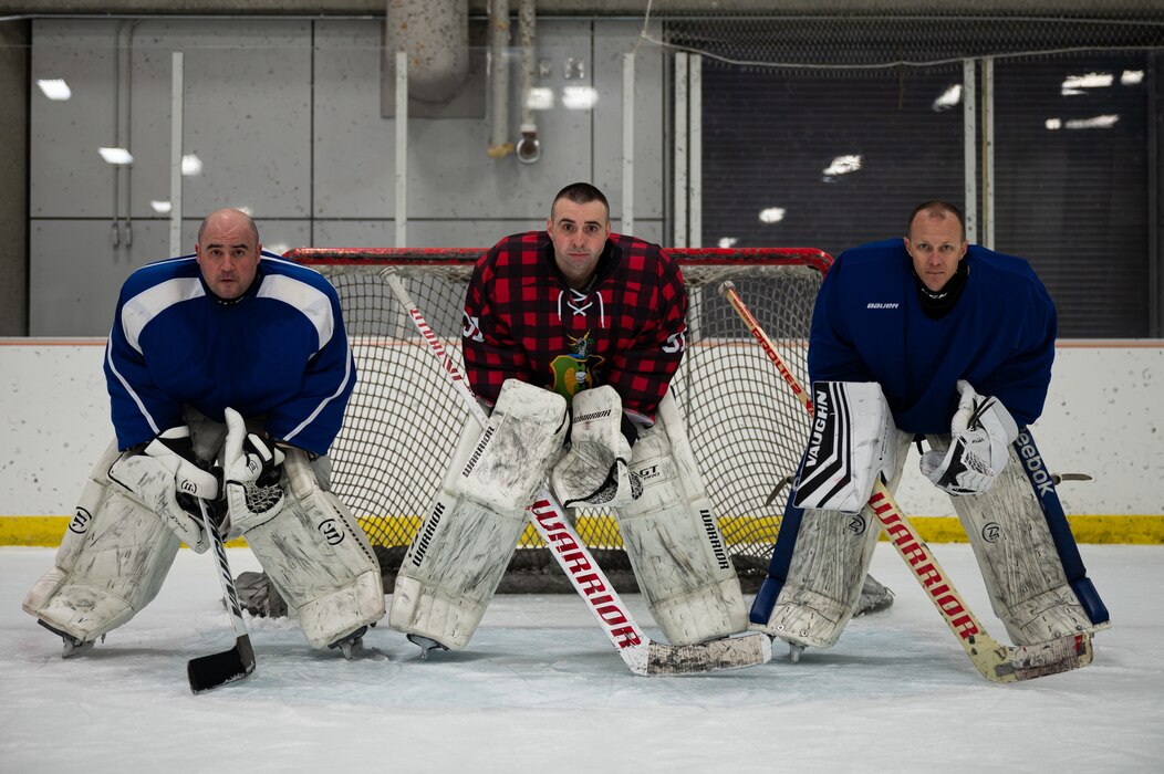 Members of the Eielson Hockey Team pose for a group photo on Fort Wainwright, Alaska, Feb. 2, 2022.
