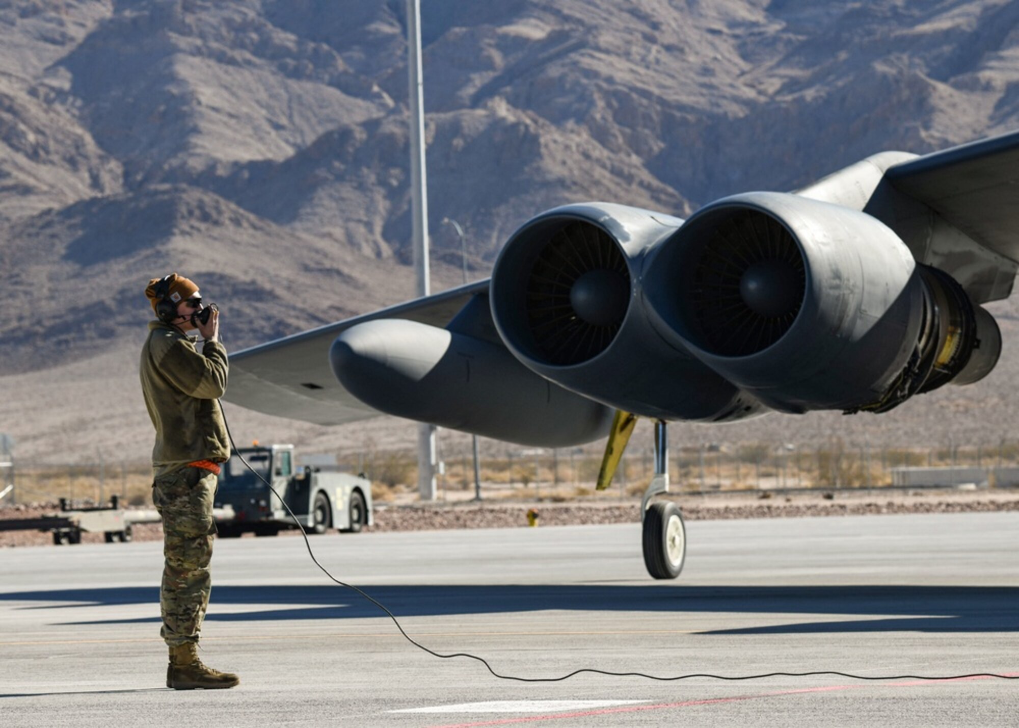 A 5th Aircraft Maintenance Squadron Airman performs B-52H Stratofortress preflight procedures during Red Flag-Nellis 22-1 on Jan. 26, 2022, at Nellis Air Force Base, Nevada. Red Flag-Nellis 22-1 provides realistic combat training that saves lives by increasing combat effectiveness. (U.S. Air Force photo by Senior Airman Michael A. Richmond)