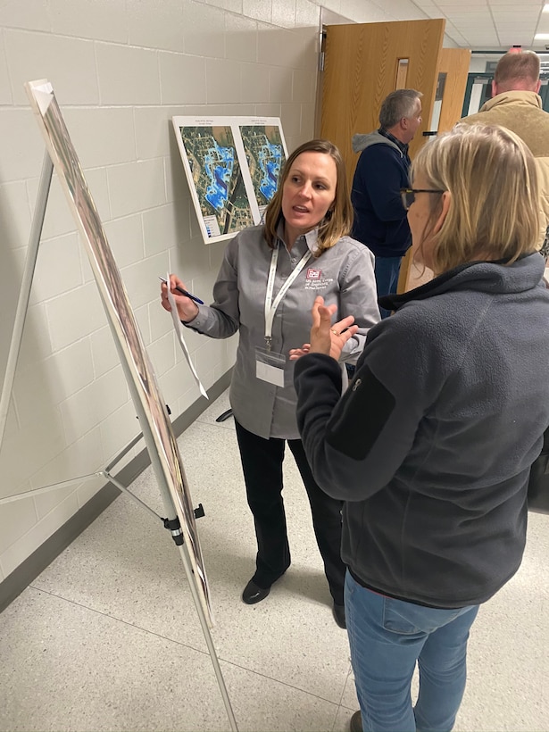 Hydraulic engineer talks with a member of the public