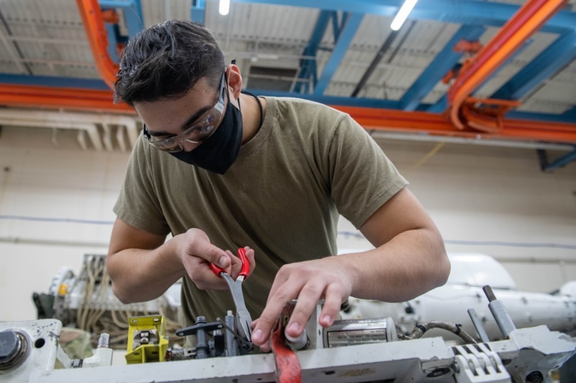 Airman 1st Class Adrian Valle, 28th Munitions Squadron armament systems apprentice, constructs an ejector rack at Ellsworth Air Force Base, S.D., Feb. 4, 2022.