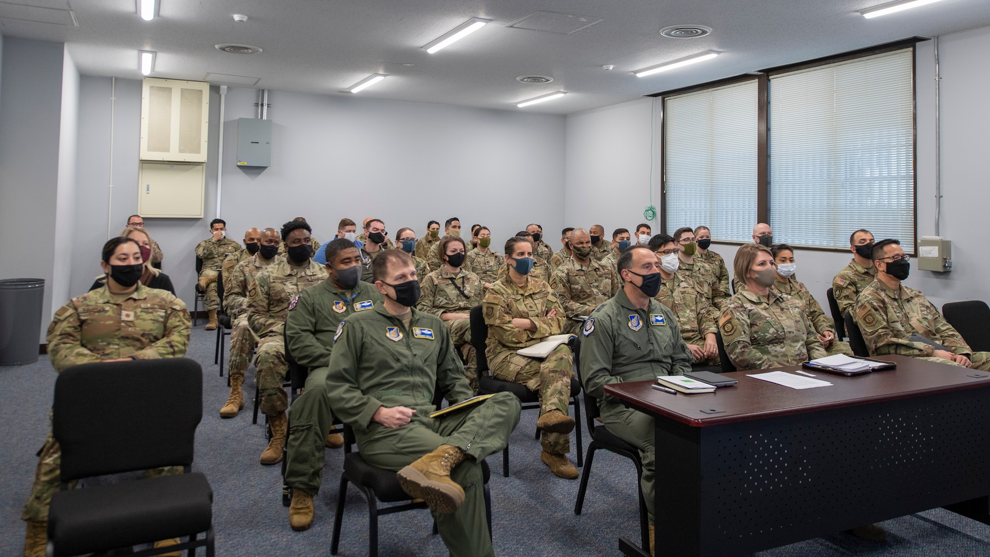 Leadership and Airmen from 5th Air Force attend a virtual all-call with Air Force Chief of Staff Gen. CQ Brown, Jr., and Chief Master Sgt. of the Air Force JoAnne S. Bass on Feb. 8, 2022, at Yokota Air Base, Japan. Brown and Bass held the virtual all-call to hear from 5th Air Force Airmen while still following COVID mitigations. (U.S. Air Force photo by Senior Airman Brieana E. Bolfing)