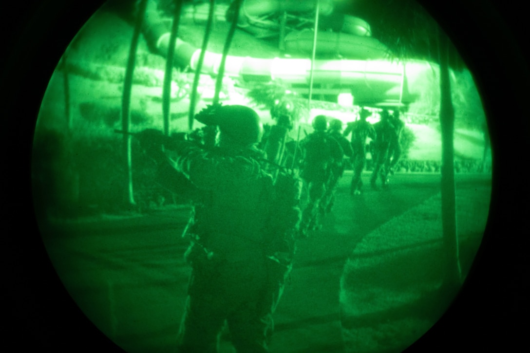 U.S. Marines with the 31st Marine Expeditionary Unit head to an extraction point at the conclusion of a training raid at Wet n’ Wild Water Park, part of Realistic Urban Training Exercise 22.1 in Kapolei, Hawaii, Jan. 10-12, 2022. The purpose of RUTEX is to incorporate the specialized individual and small unit skills of the MEU and conduct high-intensity, advanced, and complex Marine Air Ground Task Force operations in order to prepare MEUs and other designated forces to support the geographic combatant commanders. (U.S. Marine Corps photo by Lance Cpl. Chandler Stacy)