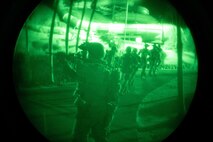 U.S. Marines with the 31st Marine Expeditionary Unit head to an extraction point at the conclusion of a training raid at Wet n’ Wild Water Park, part of Realistic Urban Training Exercise 22.1 in Kapolei, Hawaii, Jan. 10-12, 2022. The purpose of RUTEX is to incorporate the specialized individual and small unit skills of the MEU and conduct high-intensity, advanced, and complex Marine Air Ground Task Force operations in order to prepare MEUs and other designated forces to support the geographic combatant commanders. (U.S. Marine Corps photo by Lance Cpl. Chandler Stacy)