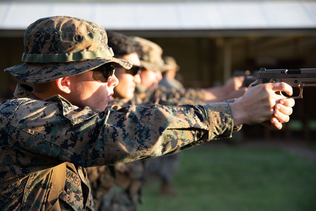 U.S. Marine Corps Lance Cpl. Connor Romeo, an engineer equipment operator with Combat Logistics Company 33, practices firing drills during the Marine Corps Marksmanship Competition-Pacific, Kaneohe Bay Range Training Facility, Marine Corps Base Hawaii, Feb. 3, 2022. The MCMCP is one of four yearly division matches throughout the U.S. Marine Corps in which U.S. Service members and the Pacific’s best shooters participate in a small arms marksmanship competition. Each course of fire is unique, utilizing rifle and pistol while being timed to select the top shooters. (U.S. Marine Corps photo by Cpl. Brandon Aultman)