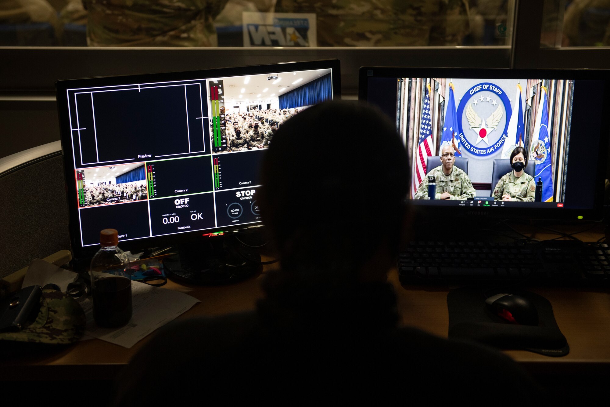 Navy Petty Officer 2nd Class Sarah Ley, American Forces Network Tokyo maintenance technician, checks the live feed for a virtual all-call with Air Force Chief of Staff Gen. CQ Brown, Jr., and Chief Master Sgt. of the Air Force JoAnne S. Bass Feb. 8, 2022, at Yokota Air Base, Japan. Brown and Bass conducted the virtual all-call across U.S. Air Force bases in Japan rather than in person to mitigate the spread of COVID-19. (U.S. Air Force photo by Tech. Sgt. Joshua Edwards)