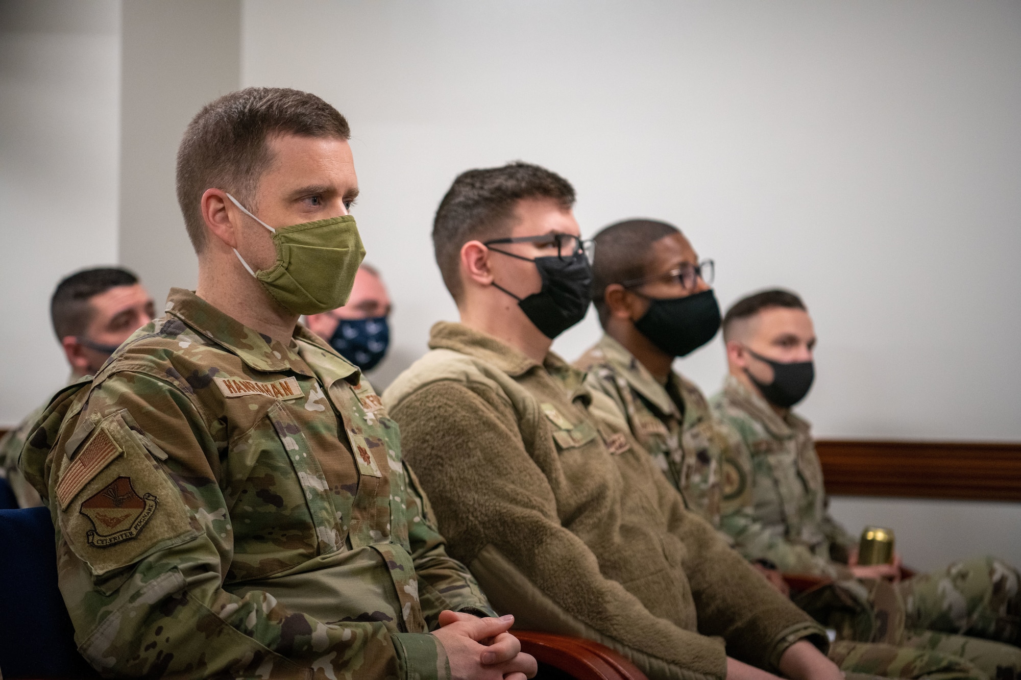 Airmen from the 374th Airlift Wing attend a virtual all-call with Air Force Chief of Staff Gen. CQ Brown, Jr., and Chief Master Sgt. of the Air Force JoAnne S. Bass Feb. 8, 2022, at Yokota Air Base, Japan.