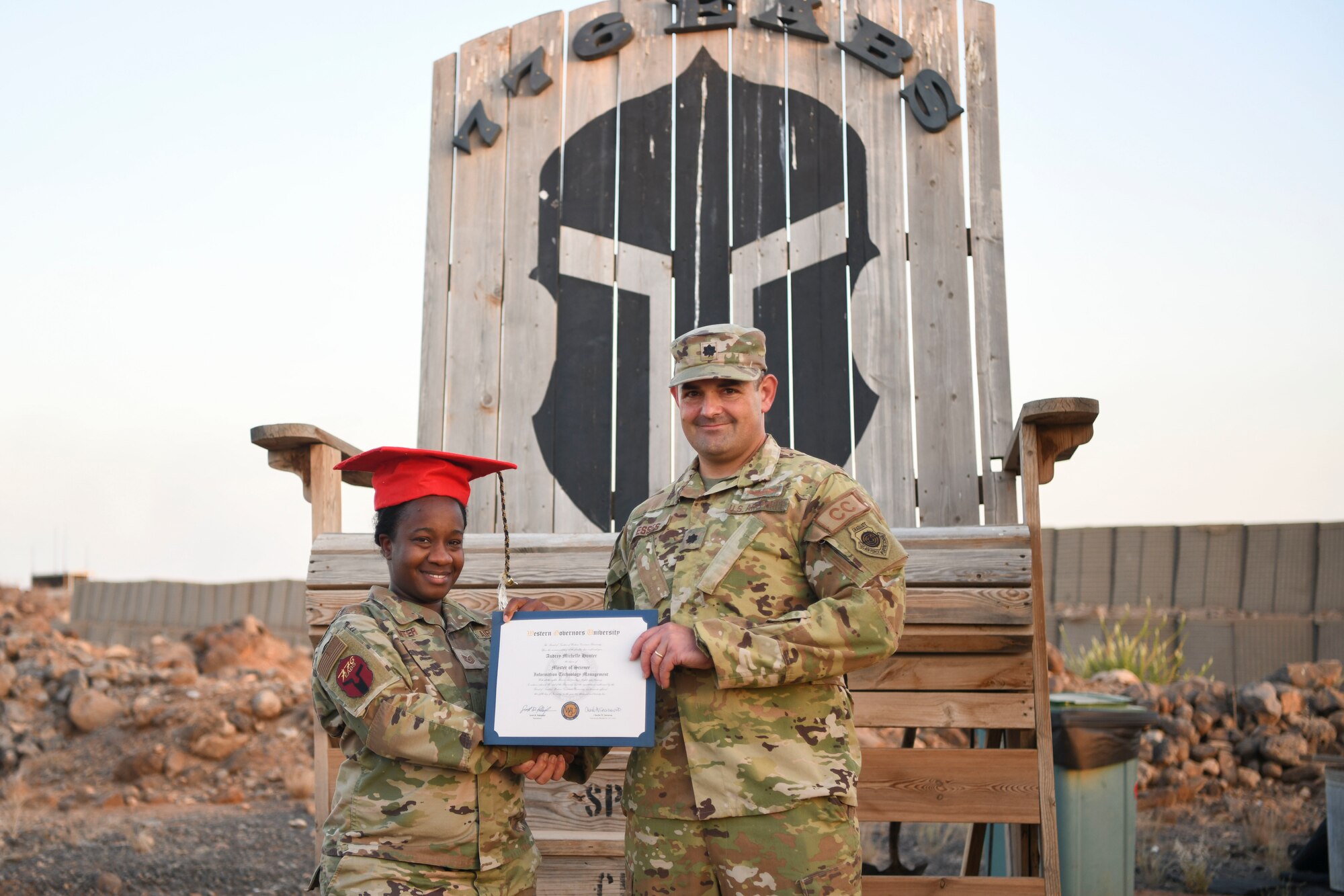 U.S. Air Force Lt. Col. Jonathan Esses, 776th Expeditionary Air Base Squadron  installation commander, right, and U.S. Air Force Tech. Sgt. Audrey Hunter, 776th EABS commander’s executive, left, pose for a photo at Chabelley Airfield, Djibouti, Feb. 6, 2022. With limited resources and the many constraints of life in East Africa, Hunter graduated with a Master of Science in Information Technology Management. The ability of service members to develop and maintain social relationships that they can draw on to manage stressors and have successful personal and professional lives is a key component of resiliency. (U.S. Air Force photo by Senior Airman Ericka A. Woolever)