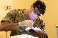 U.S. Army Maj. Anthony Gragg, a dentist with the Medical Detachment, Garrison Support Command, Vermont National Guard, examines a patient at the Regional Center Hospital at Tambacounda, Senegal, April 12, 2019. The National Guard’s State Partnership Program is a cost-effective way to strengthen alliances and attract new partners.