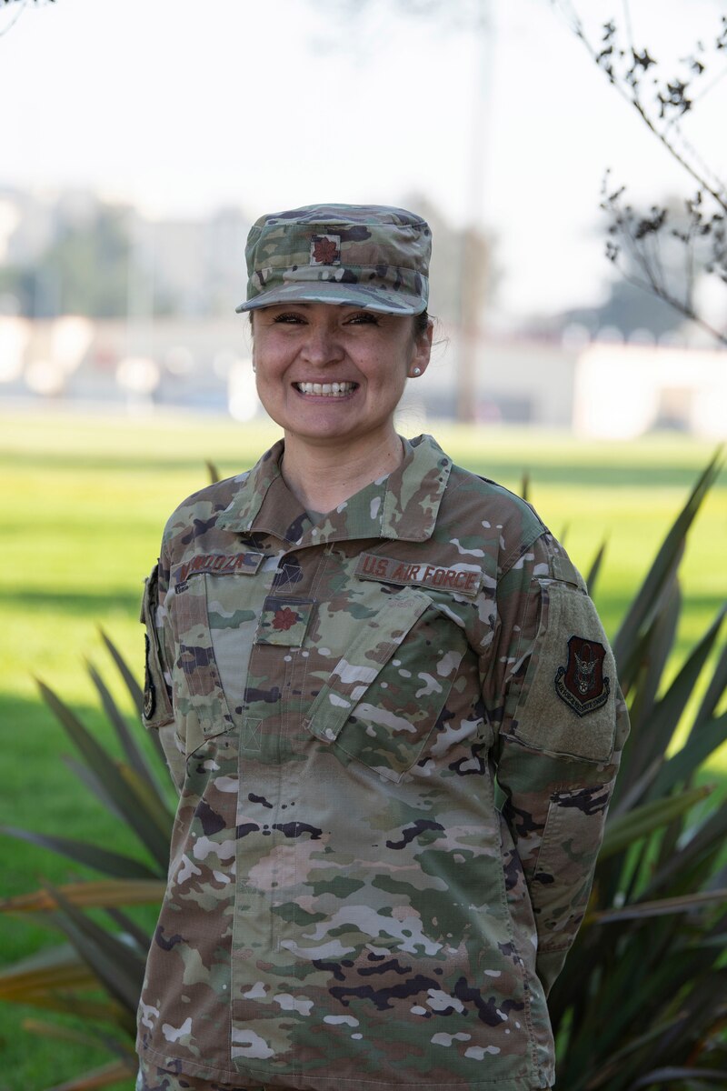 Maj. (Dr.) Lynette Mendoza, a family medicine physician with the 349th Medical Squadron at Travis Air Force Base, California, poses for a photo prior to departing on a mission supporting COVID-19 relief in New York, Feb. 4, 2022 (U.S. Air Force photo by Grant Okubo)