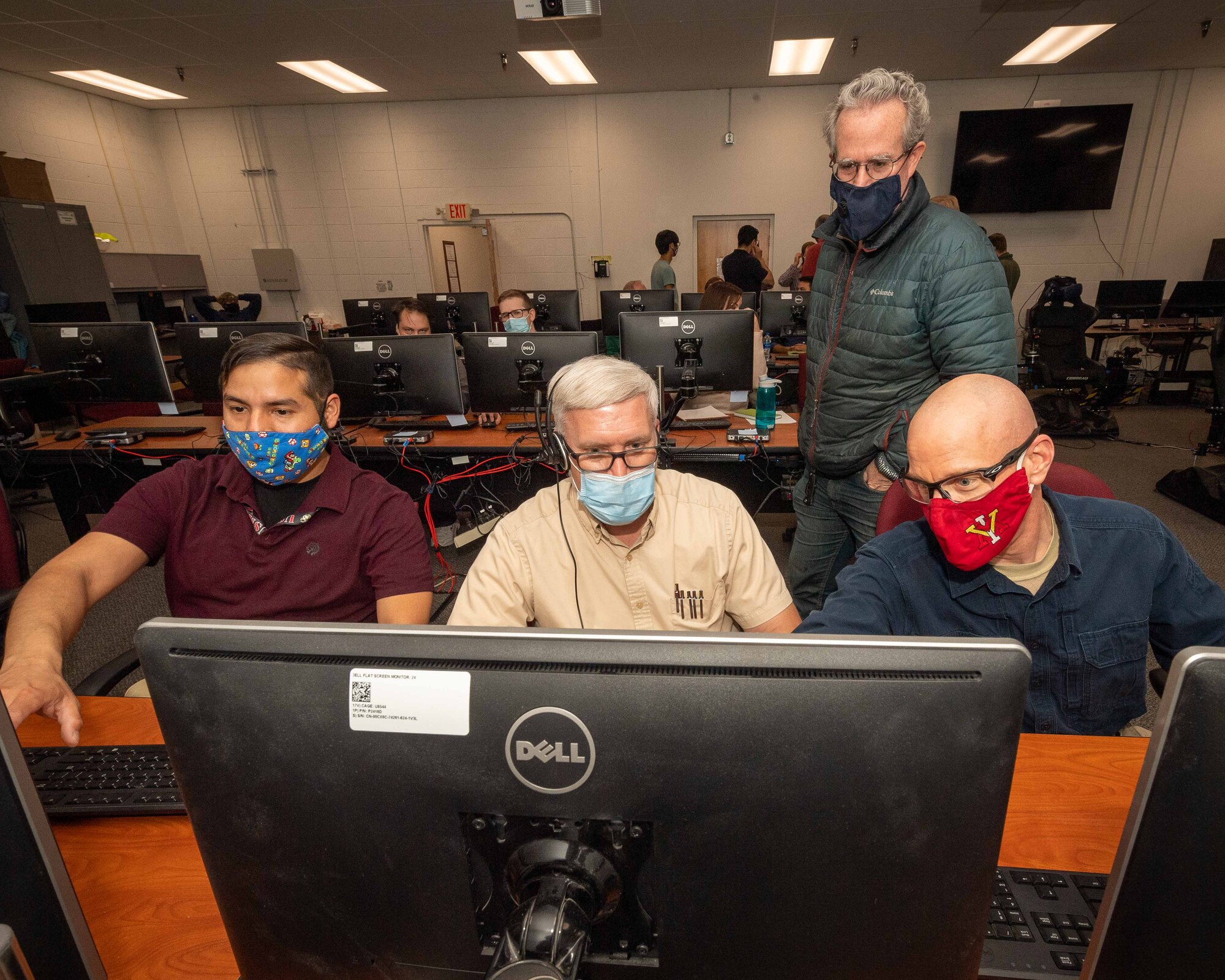 Orlando de la Garza, Ross Dudley, Jeffrey MacGillivray, and Joe Aldrich (left to right) observe operations and collect data during AFRL’s Directed Energy and Kinetic Energy Directed Energy Concept Utility Experiment (DEKE DEUCE) held at Kirtland AFB, N.M. Jan. 24 – 28, 2022. (U.S. Air Force photo/Allen Winston)