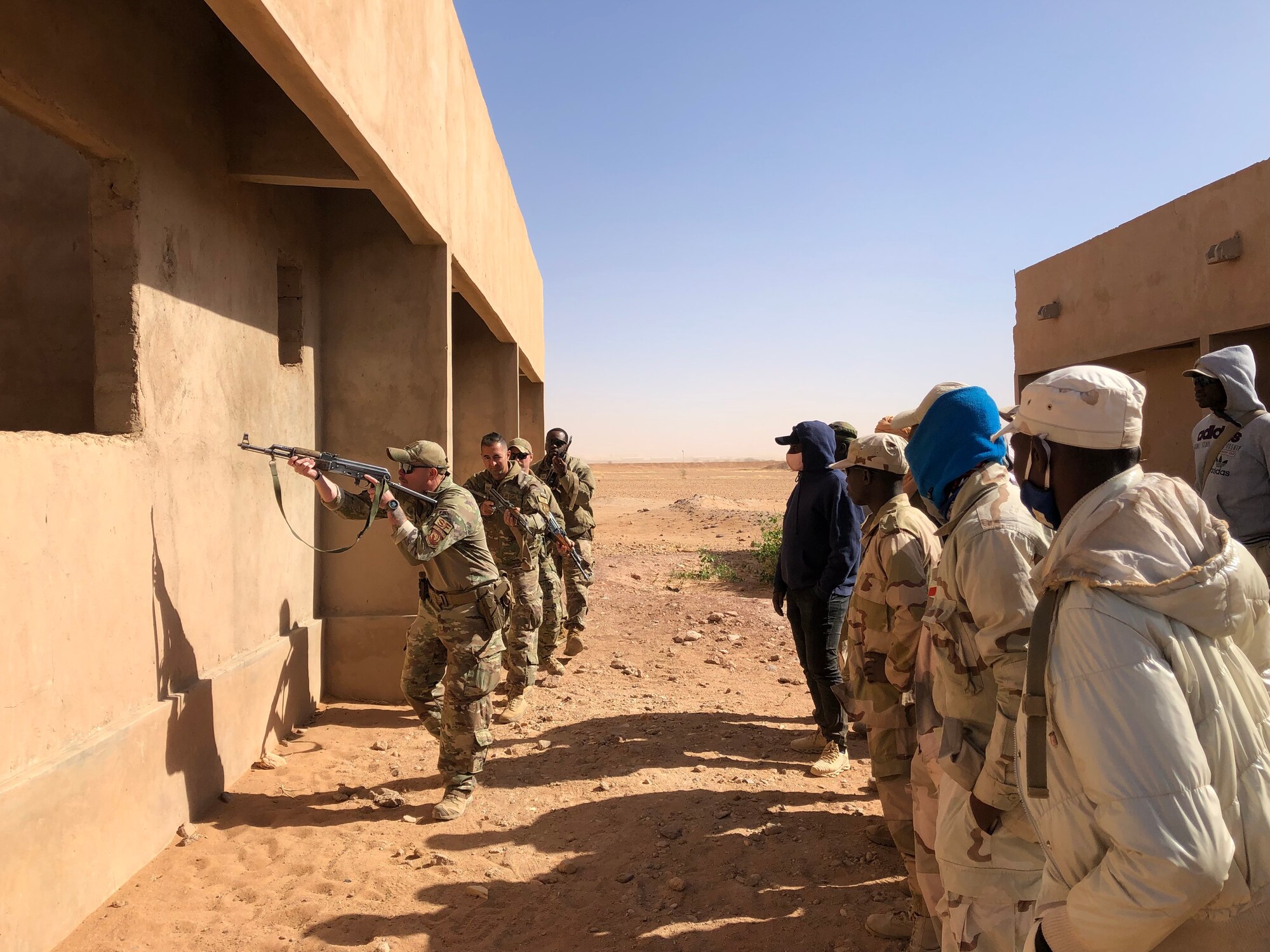 The 409th Expeditionary Security Forces Squadron air advisors provided close-quarters battle training to the Nigerien Armed Forces (French language: Forces Armées Nigeriennes), at Nigerien Air Base 201, Agadez, Niger, Feb. 3, 2022 This training is part of an eight-week course, where 30 FAN members trained on various tactics to help strengthen FANdefense capabilities and counter-transnational threats. (U.S. Air Force courtesy photo by Capt. Keith Richards)