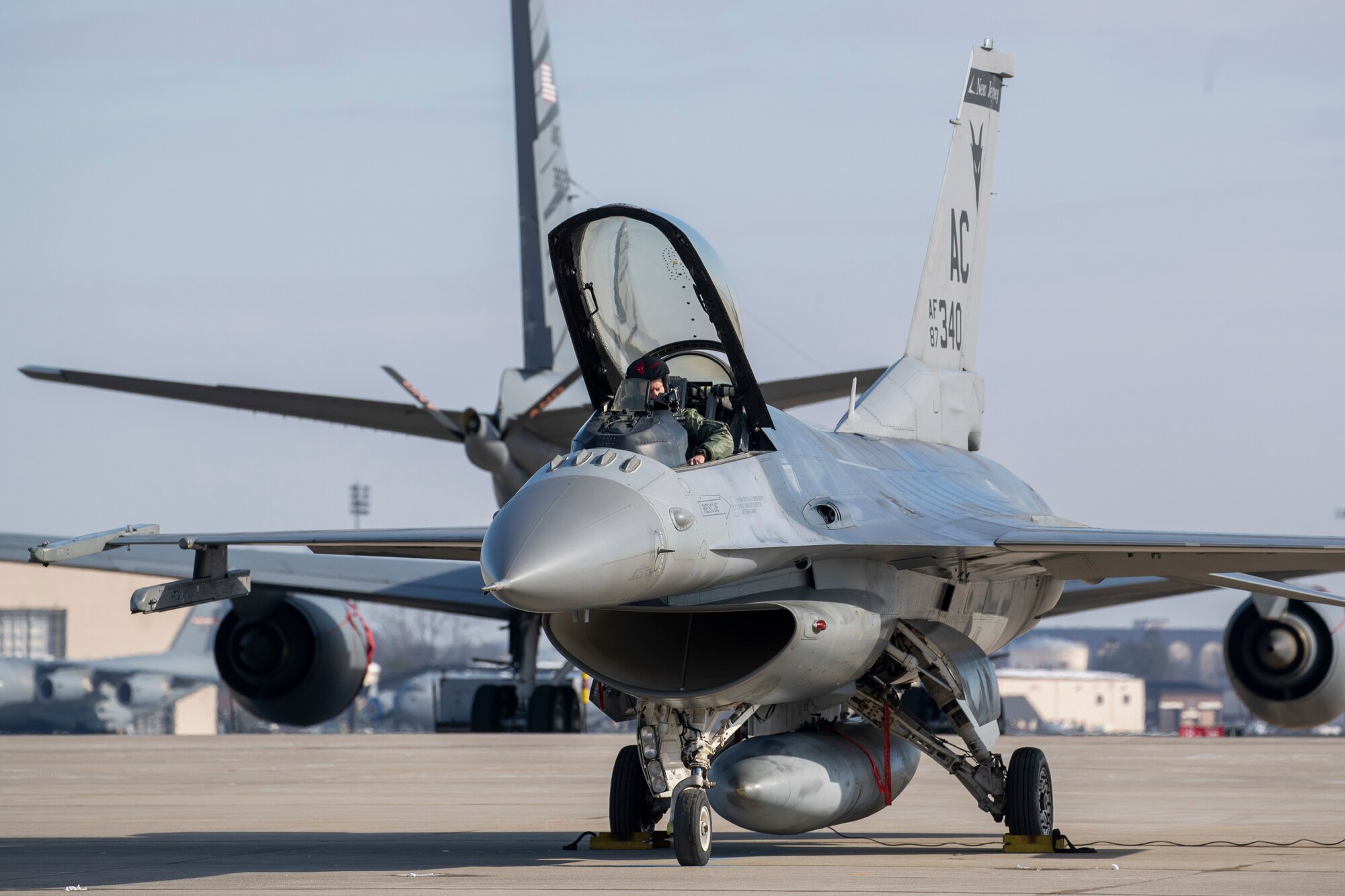 U.S. Air Force Maj. Eric Emerson prepares his F-16C Fighting Falcon for takeoff during an Agile Combat Employment (ACE) demonstration on Joint Base McGuire-Dix-Lakehurst, N.J., Feb. 1, 2022. The New Jersey Air National Guard's 177th Fighter Wing and 108th Wing recently validated ACE capabilities in partnership with the Puerto Rico Air National Guard's 156th Wing to showcase their ability operate in a remote location with a small contingence of Airman to recover, turn and launch airpower capabilities. (U.S. Air National Guard photo by Master Sgt. Matt Hecht)