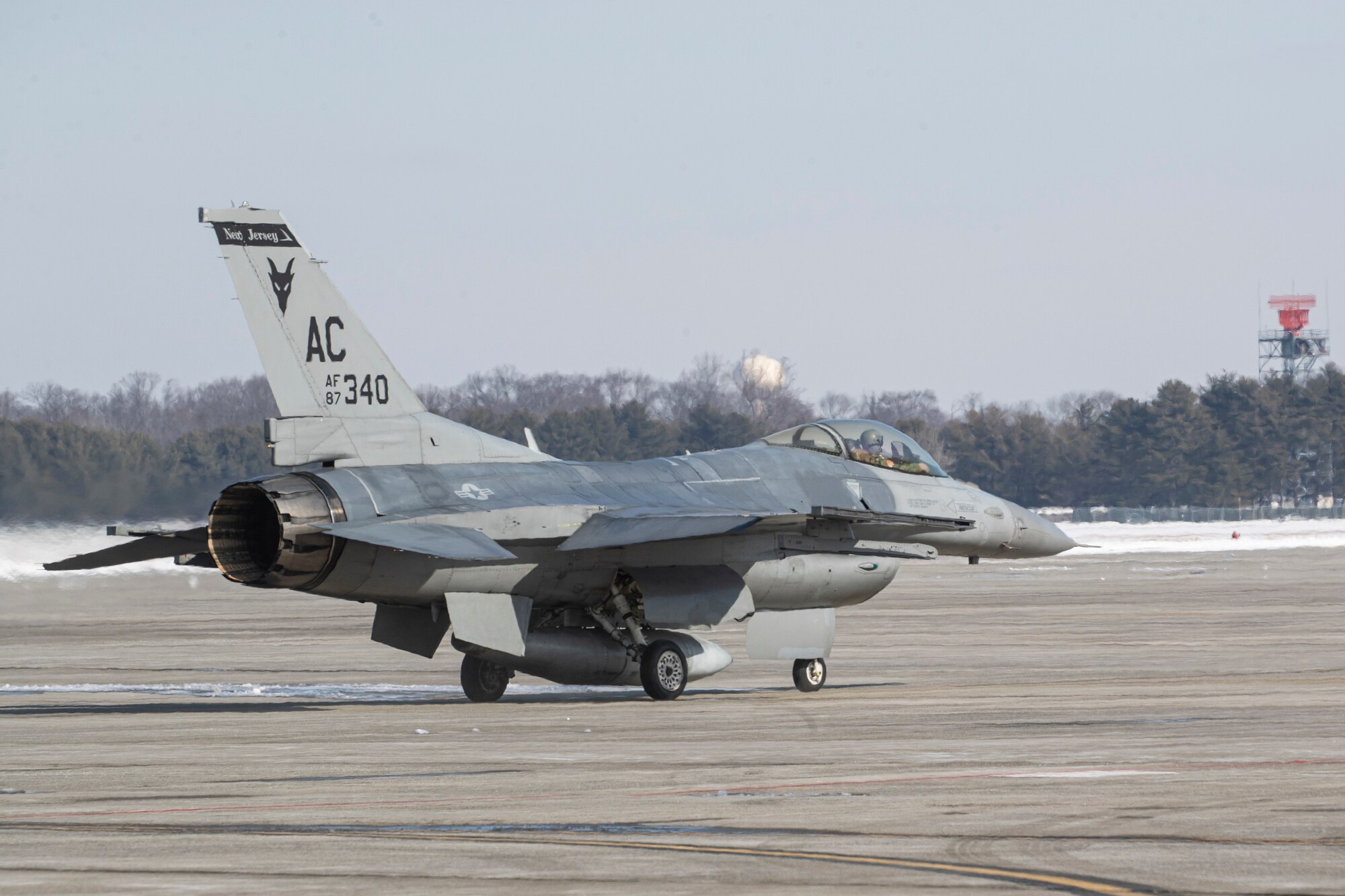 U.S. Air Force Maj. Eric Emerson prepares his F-16C Fighting Falcon for takeoff during an Agile Combat Employment (ACE) demonstration on Joint Base McGuire-Dix-Lakehurst, N.J., Feb. 1, 2022. The New Jersey Air National Guard's 177th Fighter Wing and 108th Wing recently validated ACE capabilities in partnership with the Puerto Rico Air National Guard's 156th Wing to showcase their ability operate in a remote location with a small contingence of Airman to recover, turn and launch airpower capabilities. (U.S. Air National Guard photo by Master Sgt. Matt Hecht)
