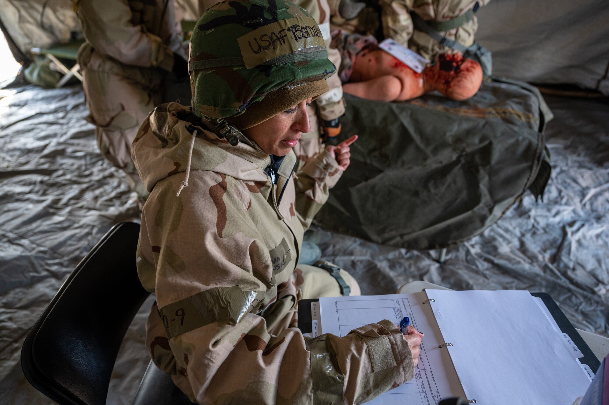 124th Force Support Squadrons services have hands-on training with mortuary affairs during a wing focus exercise for the 124th Fighter Wing at Gowen Field in Boise, Idaho, Feb 4-6, 2022. The services flight are expected to have a vast skill set, many that go unnoticed, such as search and recovery of remains after an incident, and mortuary affairs. (U.S. Air National Guard photo by Staff Sgt. Mercedee Wilds)