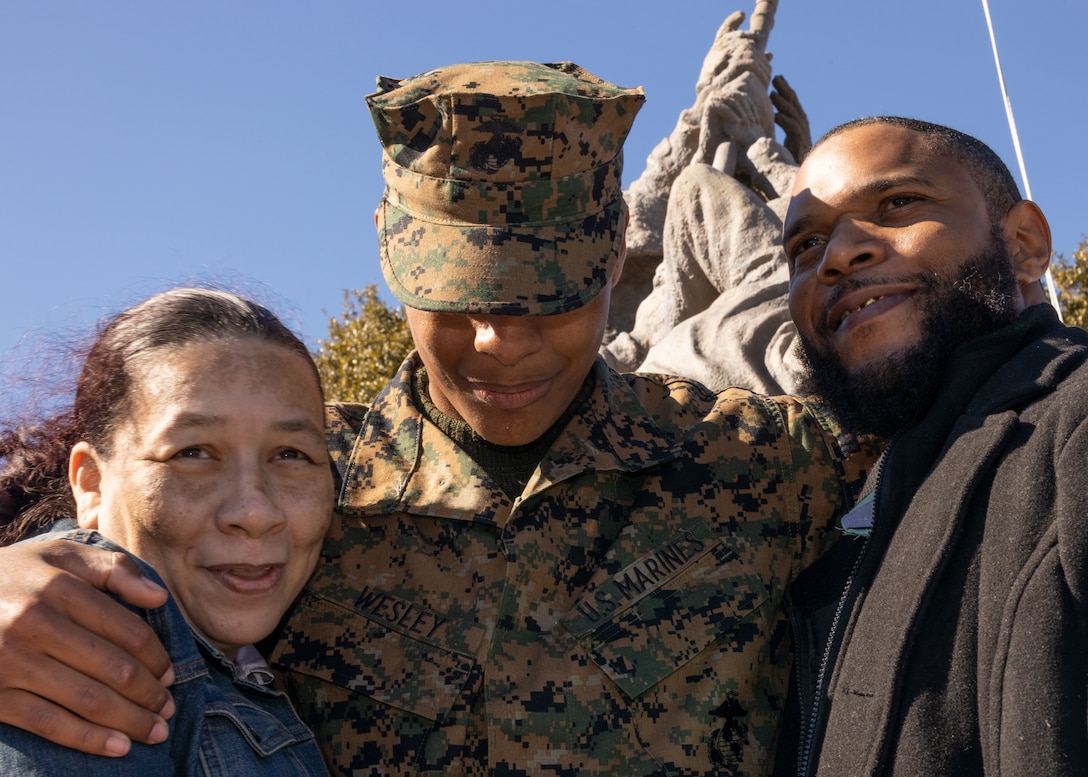 U.S. Marine Corps Pvt. Braylon Wesley, a native of Lafayette, Louisiana, embraces his mother and step father during Family Day on Marine Corps Recruit Depot Parris Island, South Carolina, Jan. 27, 2022. Wesley reported to Bravo Company, 1st Recruit Training Battalion on Nov. 1, 2021, to begin his training to become a United States Marine. Family Day is an opportunity for new Marines to visit with their families for the first time since reporting to their training company. (U.S. Marine Corps photo by Lance Cpl. Jareka Curtis)