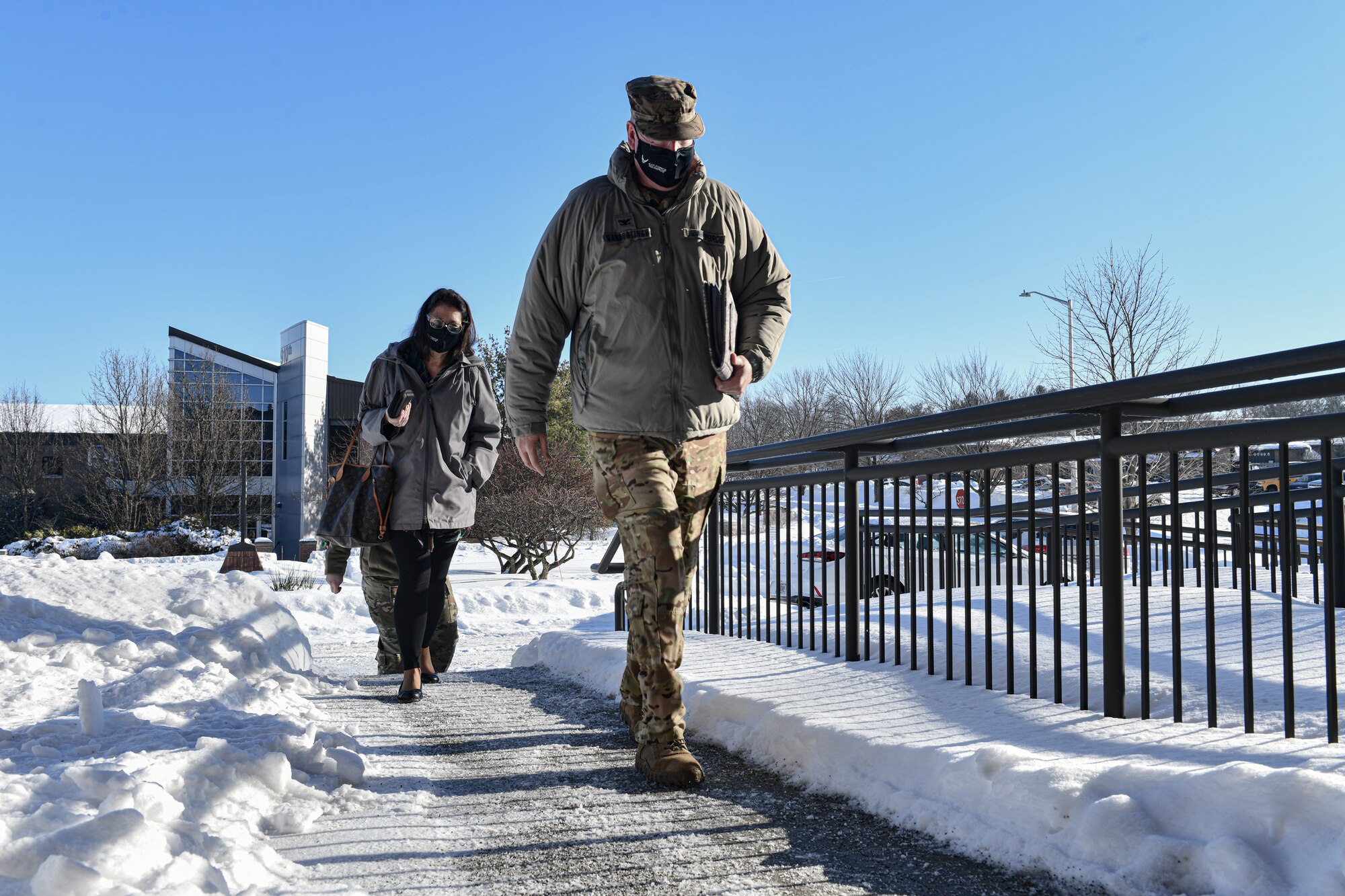 Dawn B. Androsky, director of staff with Headquarters Air Force Reserve Command, and Col. Jeff Van Dootingh, 910th Airlift Wing commander, walk into the operations building on Feb. 6, 2022, at Youngstown Air Reserve Station, Ohio.
