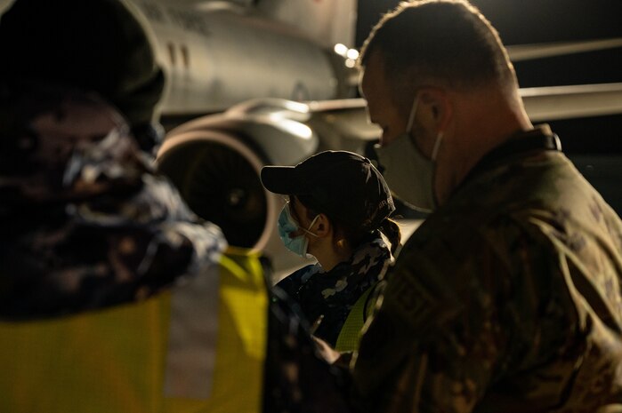 people standing in front of aircraft