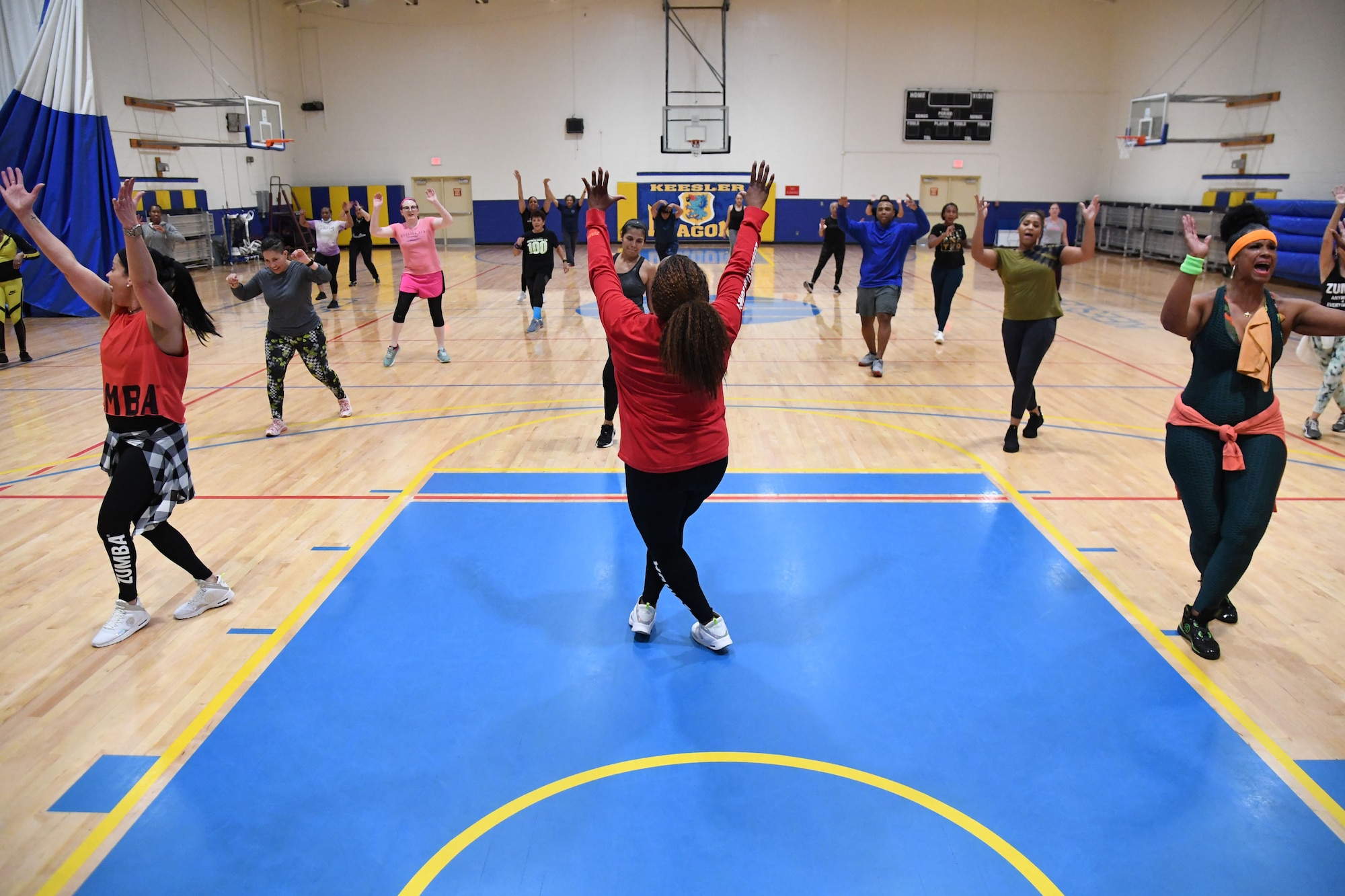 Keesler personnel participate in a Zumba Dance Class inside the Blake Fitness Center at Keesler Air Force Base, Mississippi, Feb. 8, 2022. The Black History Month Observance Committee hosted event in celebration of Black History Month, which is celebrated throughout February. This year's theme is Black Health & Wellness. (U.S. Air Force photo by Kemberly Groue)