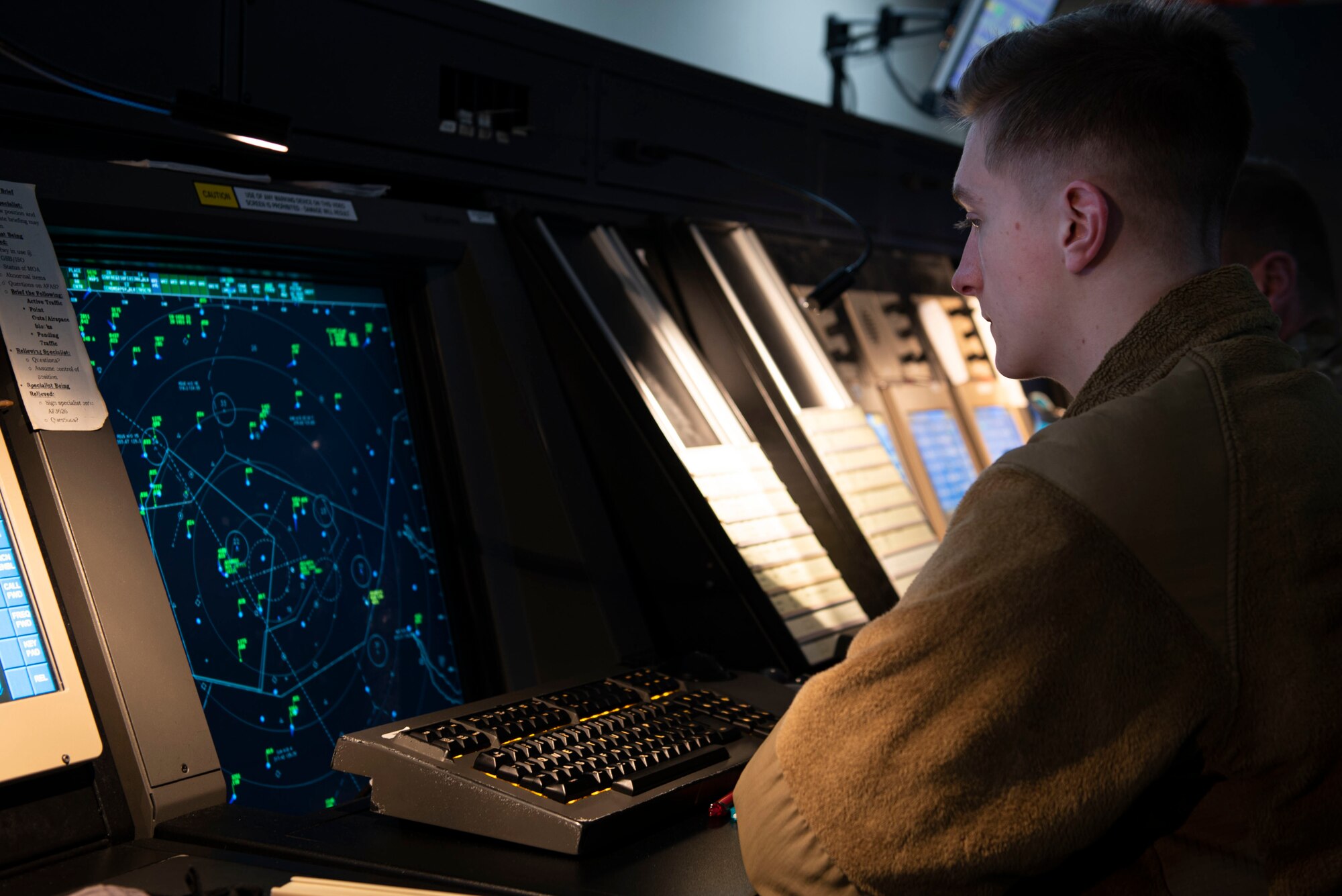 Airman 1st Class Zachary Stoltzmann, 4th Operations Support Squadron air traffic control specialist, monitors flight patterns at Seymour Johnson Air Force Base, North Carolina, Feb. 2, 2022. The 4th OSS Radar Approach Control Airmen provide efficient and effective air traffic control to airborne 4th Fighter Wing aircraft to ensure wartime readiness. (U.S. Air Force photo by Airman 1st Class Sabrina Fuller)
