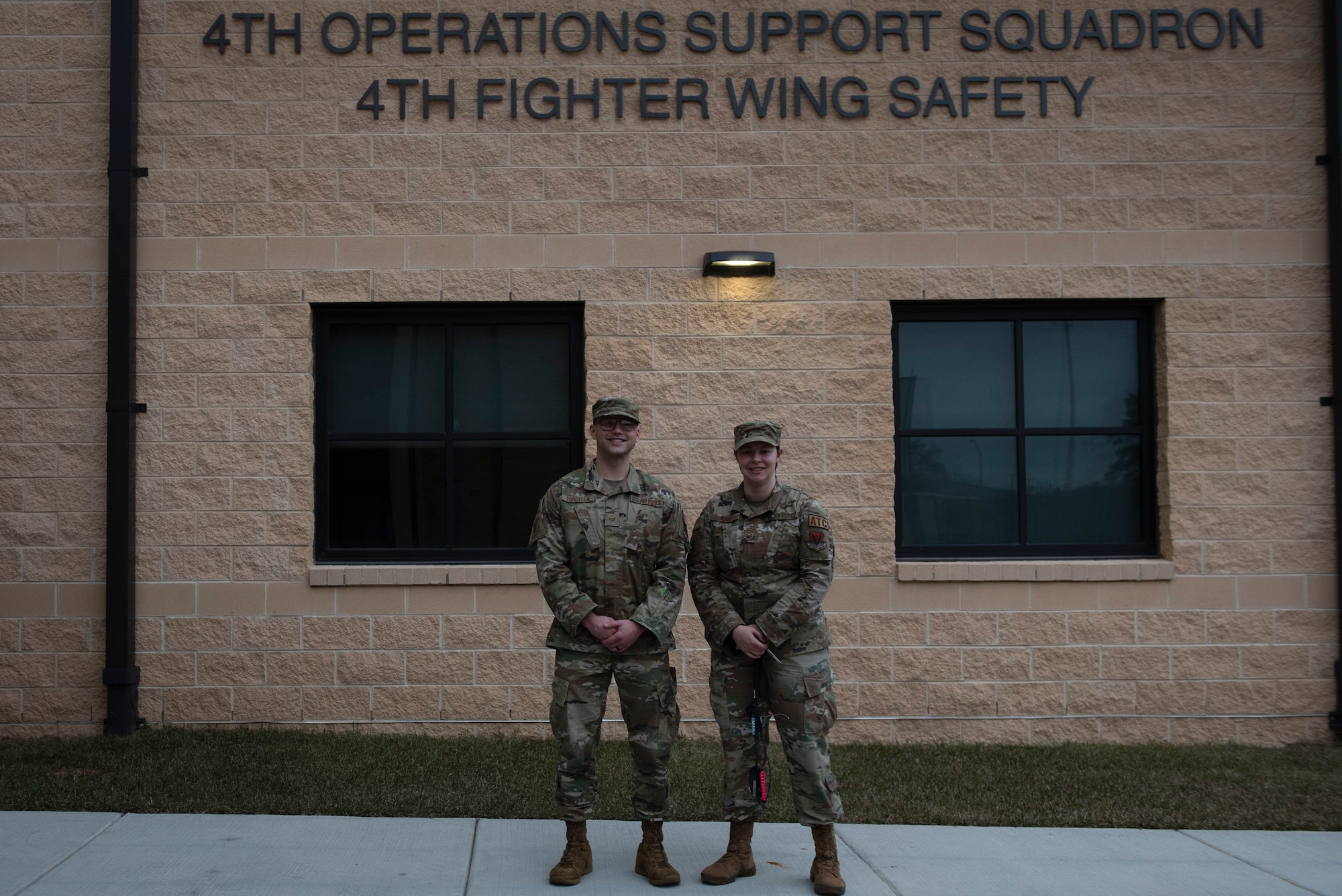 Staff Sgt. Bryce Torsella, left, 4th Operations Support Squadron Radar Approach Control watch supervisor and Tech. Sgt. Justine King, 4th OSS RAPCON senior watch supervisor, pose for a photo at Seymour Johnson Air Force Base, North Carolina, Jan. 20, 2022. Torsella and King were responsible for communications with a civilian pilot during an emergency landing on Dec. 17, 2021. (U.S. Air Force photo by Airman 1st Class Sabrina Fuller)