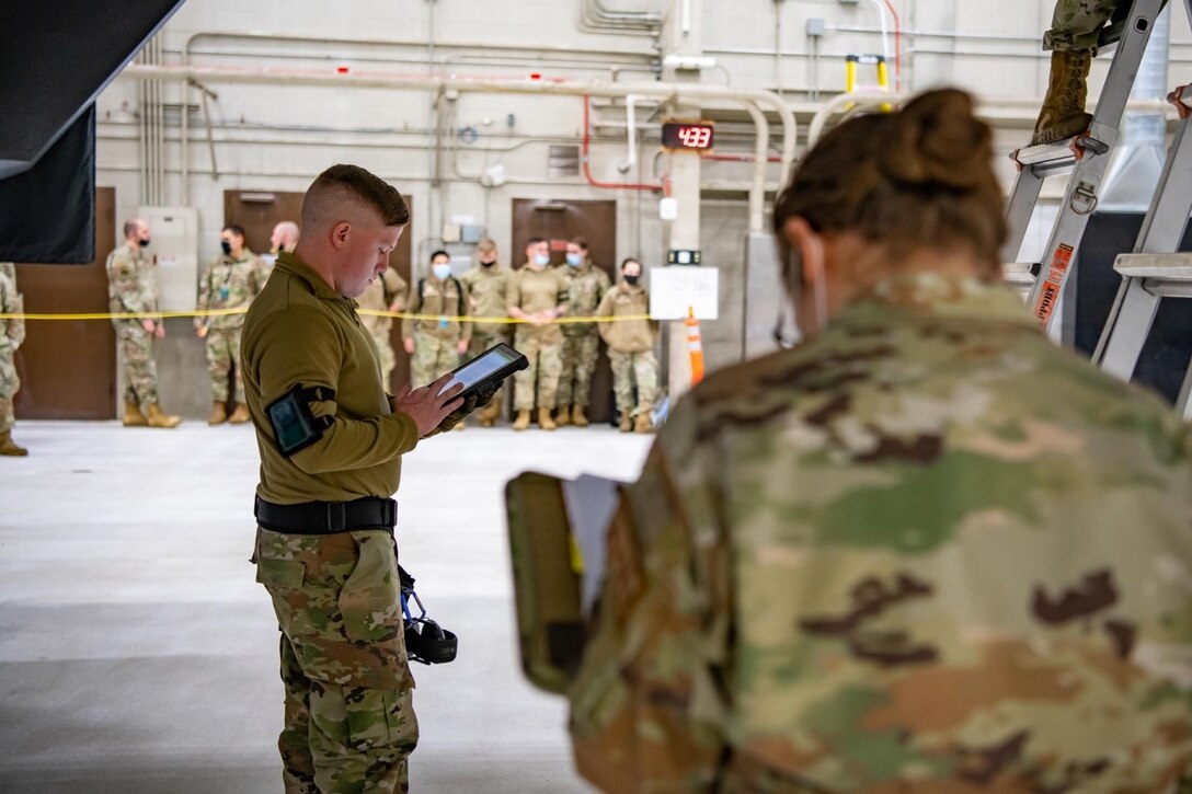 Staff Sgt. Cody Wagner, 28th Maintenance Group weapons load crew chief, reviews technical orders while participating in a quarterly load competition on Ellsworth Air Force Base, S.D., Jan. 28, 2022.