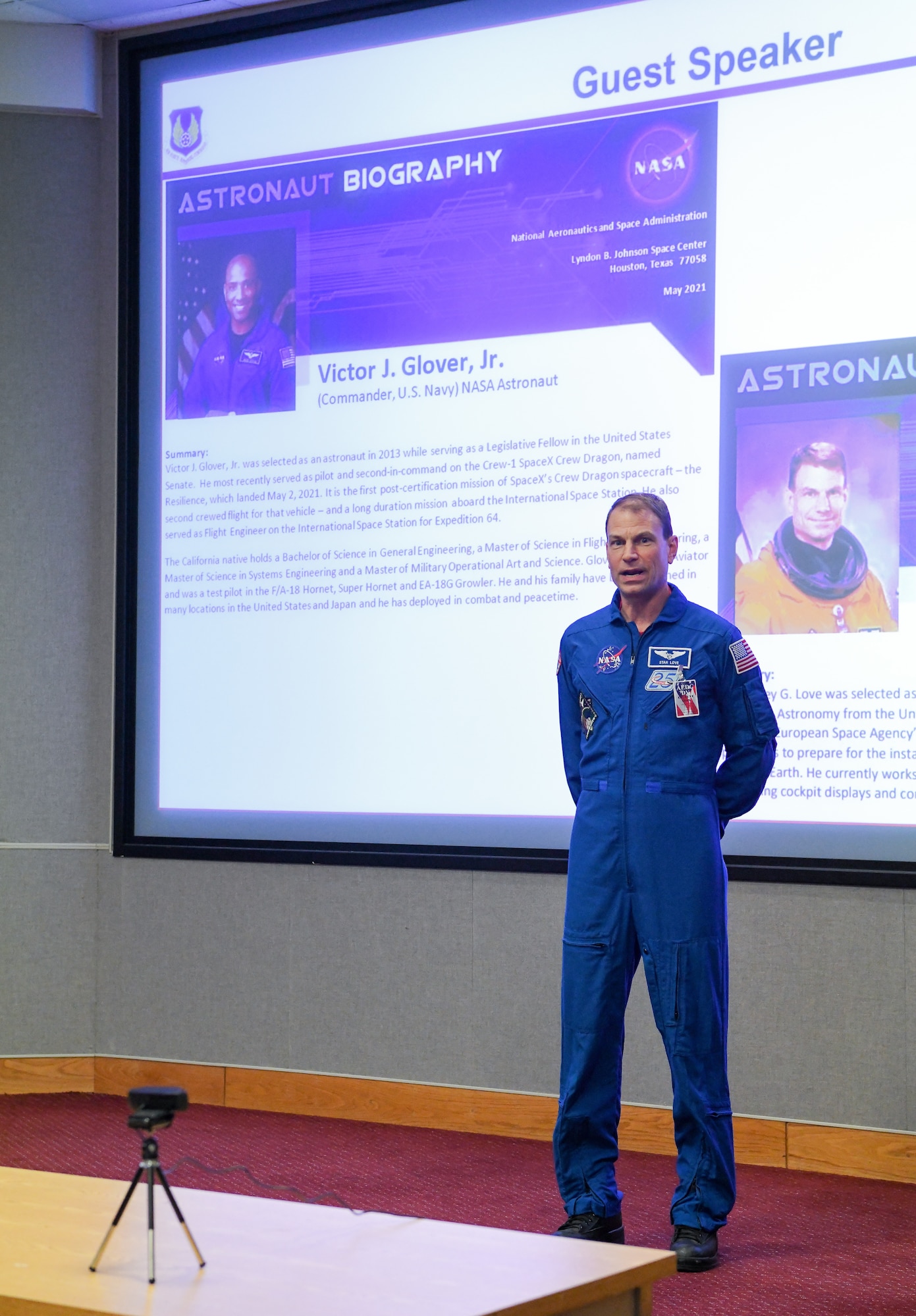 Astronaut in flight suit speaking