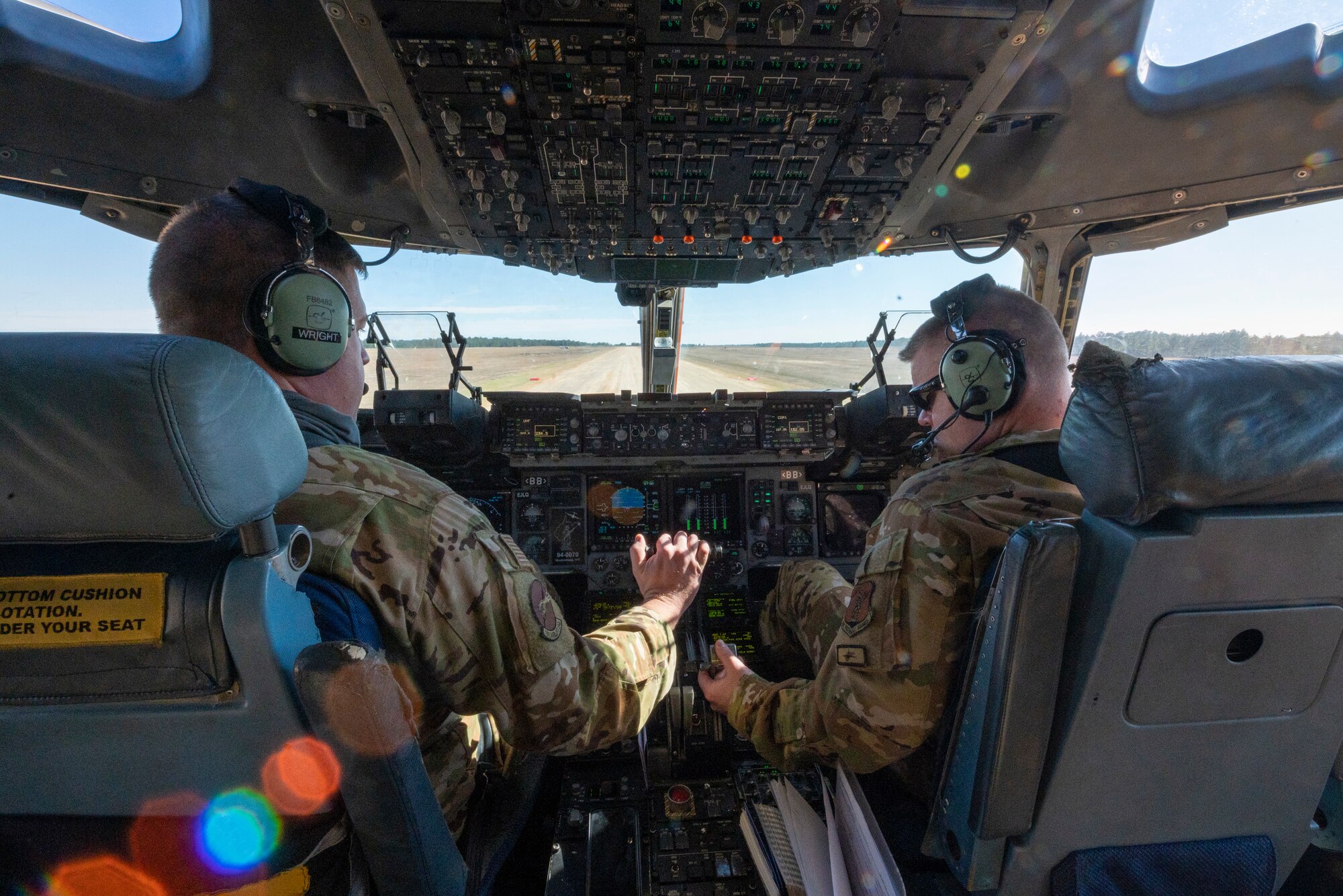 U.S. Air Force Lt. Col. Randall Wright and Maj. David Groom both pilots with the 167th Airlift Squadron await permission to takeoff on a semi-prepared runway during exercise Green Flag Little Rock 22-03 at Ft. Polk, Louisiana, Jan. 13, 2022. GFLR 22-03 focused on three joint-accredited items: combat airlift; survival, evasion, resistance and escape; and aeromedical evacuation.