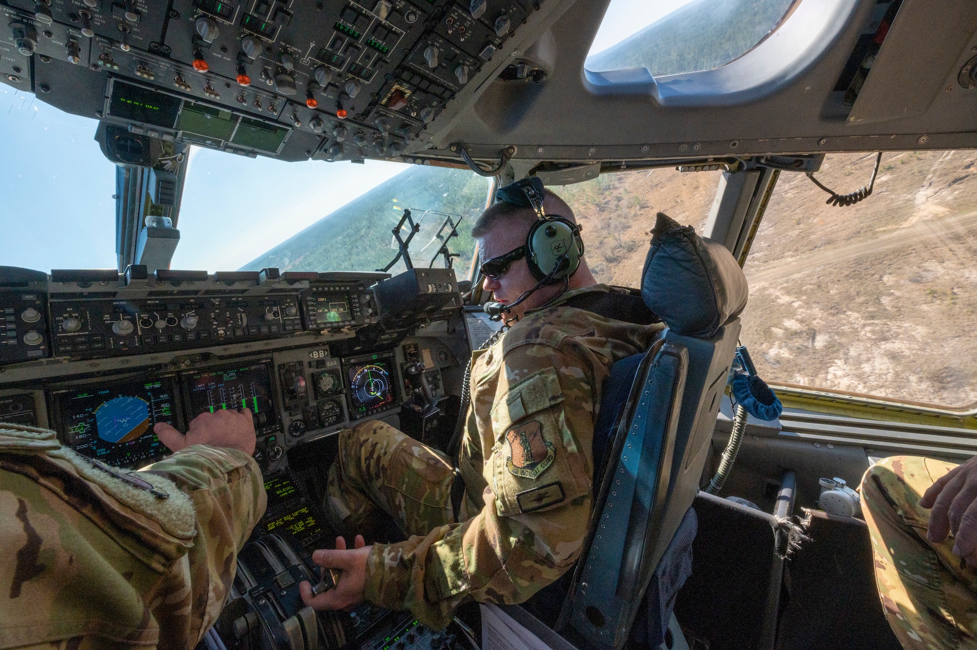 U.S. Air Force Maj. David Groom a pilot with the 167th Airlift Squadron banks to the right immediately after takeoff from on a semi-prepared runway during exercise Green Flag Little Rock 22-03 at Ft. Polk, Louisiana, Jan. 13, 2022. GFLR 22-03 focused on three joint-accredited items: combat airlift; survival, evasion, resistance and escape; and aeromedical evacuation.