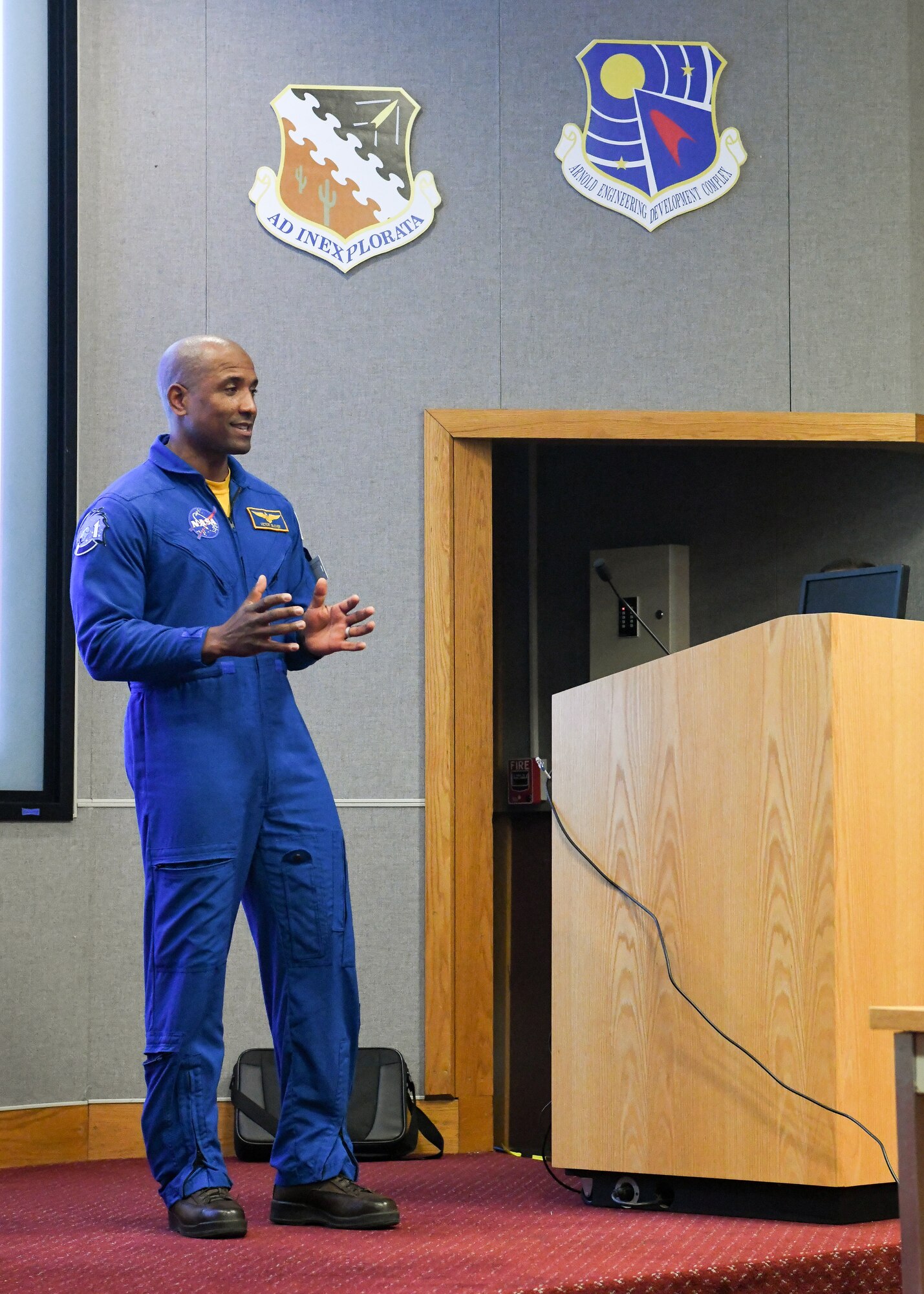 Astronaut in flight suit speaking