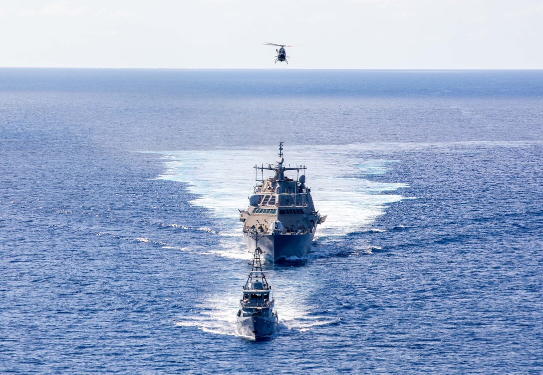 CARIBBEAN SEA (Feb. 9, 2022) The Freedom-variant littoral combat ship USS Milwaukee (LCS 5), Jamaica Defence Force (JDF) Coast Guard offshore patrol vessel HMJS Alexander Bustamante and a JDF Air Wing Bell 429 helicopter conduct a bilateral maritime exercise, Feb. 9, 2022. Milwaukee is deployed to the U.S. 4th Fleet area of operations to support Joint Interagency Task Force South’s mission, which includes counter-illicit drug trafficking missions in the Caribbean and Eastern Pacific. (U.S. Navy photo by Mass Communication Specialist 2nd Class Danielle Baker/Released)