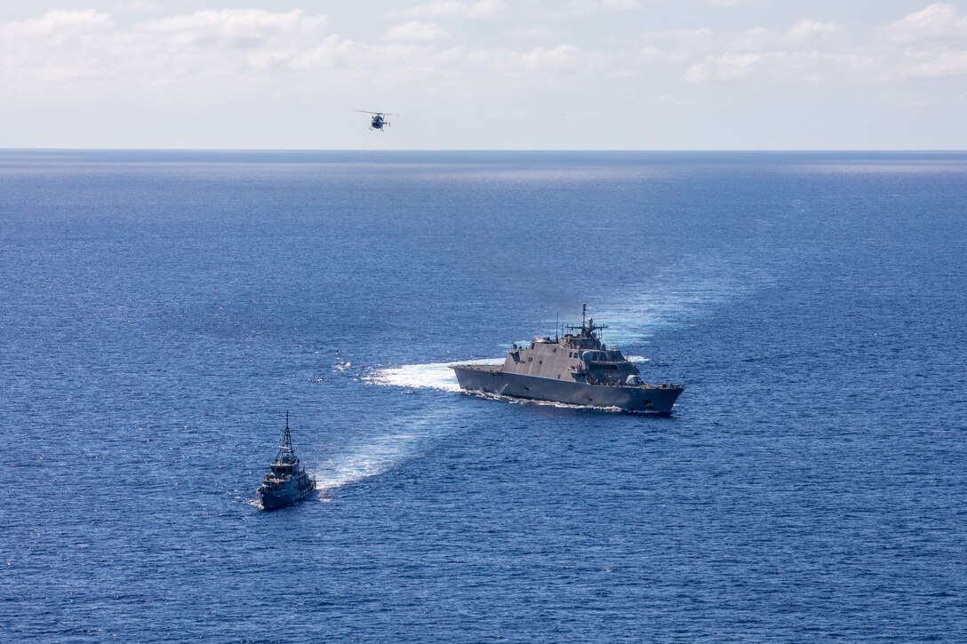 CARIBBEAN SEA (Feb. 9, 2022) The Freedom-variant littoral combat ship USS Milwaukee (LCS 5), Jamaica Defence Force (JDF) Coast Guard offshore patrol vessel HMJS Alexander Bustamante and a JDF Air Wing Bell 429 helicopter conduct a bilateral maritime exercise, Feb. 9, 2022. Milwaukee is deployed to the U.S. 4th Fleet area of operations to support Joint Interagency Task Force South’s mission, which includes counter-illicit drug trafficking missions in the Caribbean and Eastern Pacific. (U.S. Navy photo by Mass Communication Specialist 2nd Class Danielle Baker/Released)