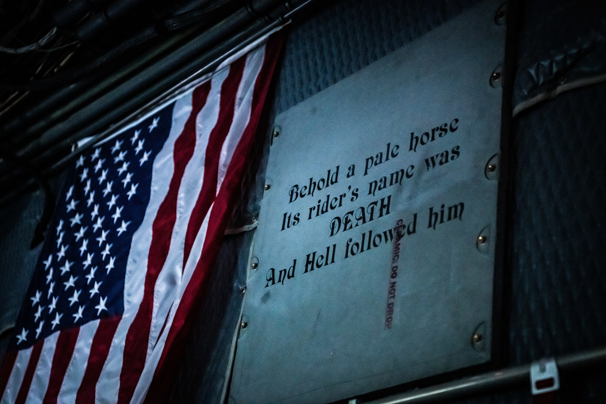 A U.S. flag and display aboard an AC-130W Stinger II gunship assigned to the 16th Special Operations Squadron during a Spirit 03 memorial flight at Cannon Air Force Base, New Mexico, Jan. 31, 2022. Spirit 03 was the last AC-130 gunship shot down in combat, lost during Operation Desert Storm. The 16 SOS honored the crew by performing live fire training at the Spirit live fire range at Melrose Air Force Range, conducted a memorial flyover at Cannon, and held a remembrance brief after the flights detailing the story of the aircrew and advancements made as a result of the loss of Spirit 03. (U.S. Air Force photo by Airman 1st Class Drew Cyburt)