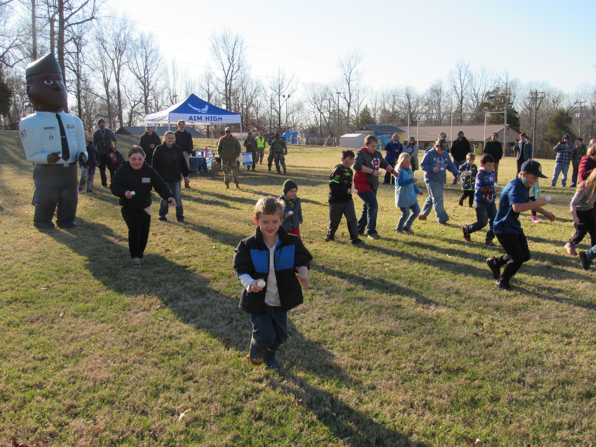 Children play during an event organized by Air Force Recruiters to help tornado victims in Dawson Springs, Kentucky, Jan. 13, 2022.