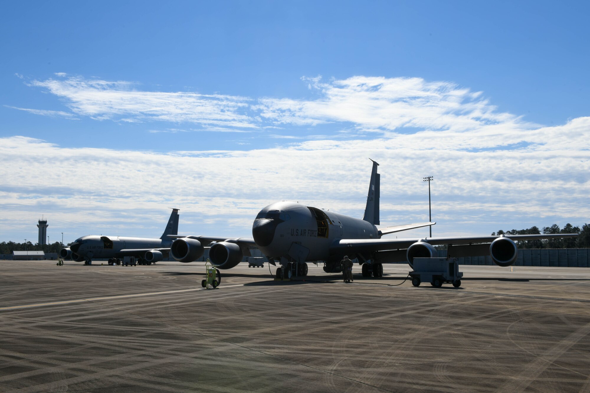 Two KC-135 Stratotankers from the 97th Air Mobility Wing are parked on Eglin Air Force Base, Florida, Feb. 5, 2022. During the AGILE JESTER mission, multiple KC-135 Stratotankers from Altus AFB refueled F-35 Lighting IIs, C-17 Globemaster IIIs and AC-130U Spookies, both during the day and at night. (U.S. Air Force photo by Airman 1st Class Trenton Jancze)