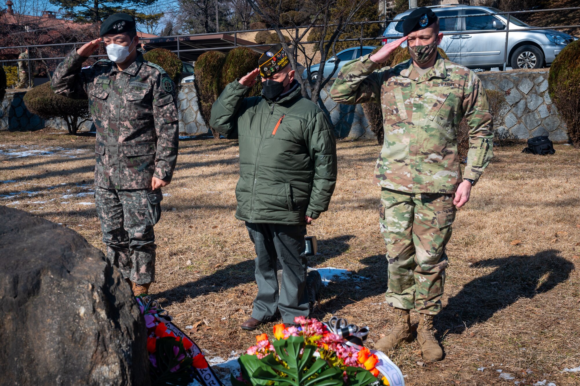 R.O.K. Army Col. Sung Jin Park (left), 3rd Battlefield Coordination Detachment-Korea commander, Earnest Lee, Korean War veteran and Hill 180 remembrance ceremony distinguished guest and U.S. Army Col. Jeffrey Munn, 3rd Battlefield Coordination Detachment-Korea commander, render a salute