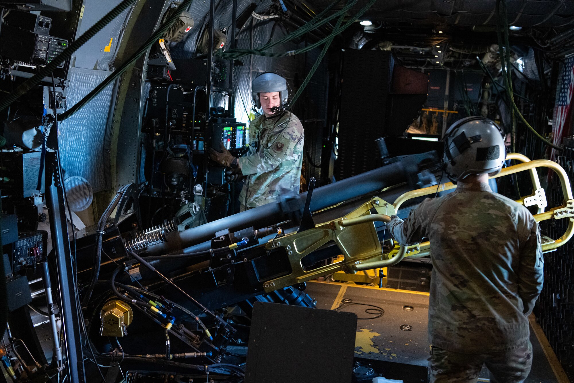 U.S. Air Force Staff Sgt. Jedediah Parks and Senior Airman Sean Curtin, 16th Special Operations Squadron AC-130W Stinger II aerial gunners, operate an M137A1 105mm artillery cannon during live fire training over Spirit live fire range at Melrose Air Force Range, New Mexico, Jan. 31, 2022. The 16 SOS conducted a memorial flyover honoring Spirit 03, the last AC-130 gunship to be shot down during combat. The squadron also held a remembrance brief after the flights detailing the story of the aircrew and advancements made as a result of the loss of Spirit 03. (U.S. Air Force photo by Airman 1st Class Drew Cyburt)