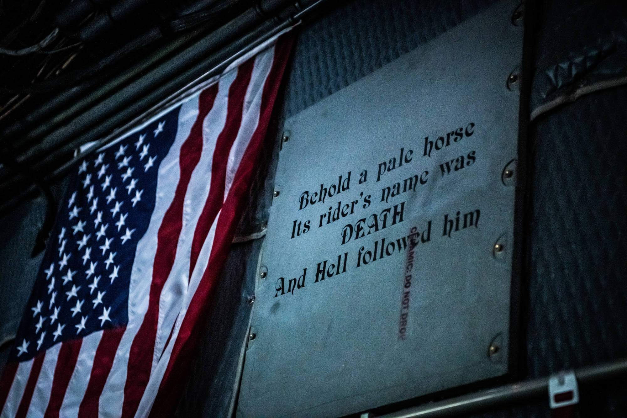 A U.S. flag and display aboard an AC-130W Stinger II gunship assigned to the 16th Special Operations Squadron during a Spirit 03 memorial flight at Cannon Air Force Base, New Mexico, Jan. 31, 2022. Spirit 03 was the last AC-130 gunship shot down in combat, lost during Operation Desert Storm. The 16 SOS honored the crew by performing live fire training at the Spirit live fire range at Melrose Air Force Range, conducted a memorial flyover at Cannon, and held a remembrance brief after the flights detailing the story of the aircrew and advancements made as a result of the loss of Spirit 03. (U.S. Air Force photo by Airman 1st Class Drew Cyburt)