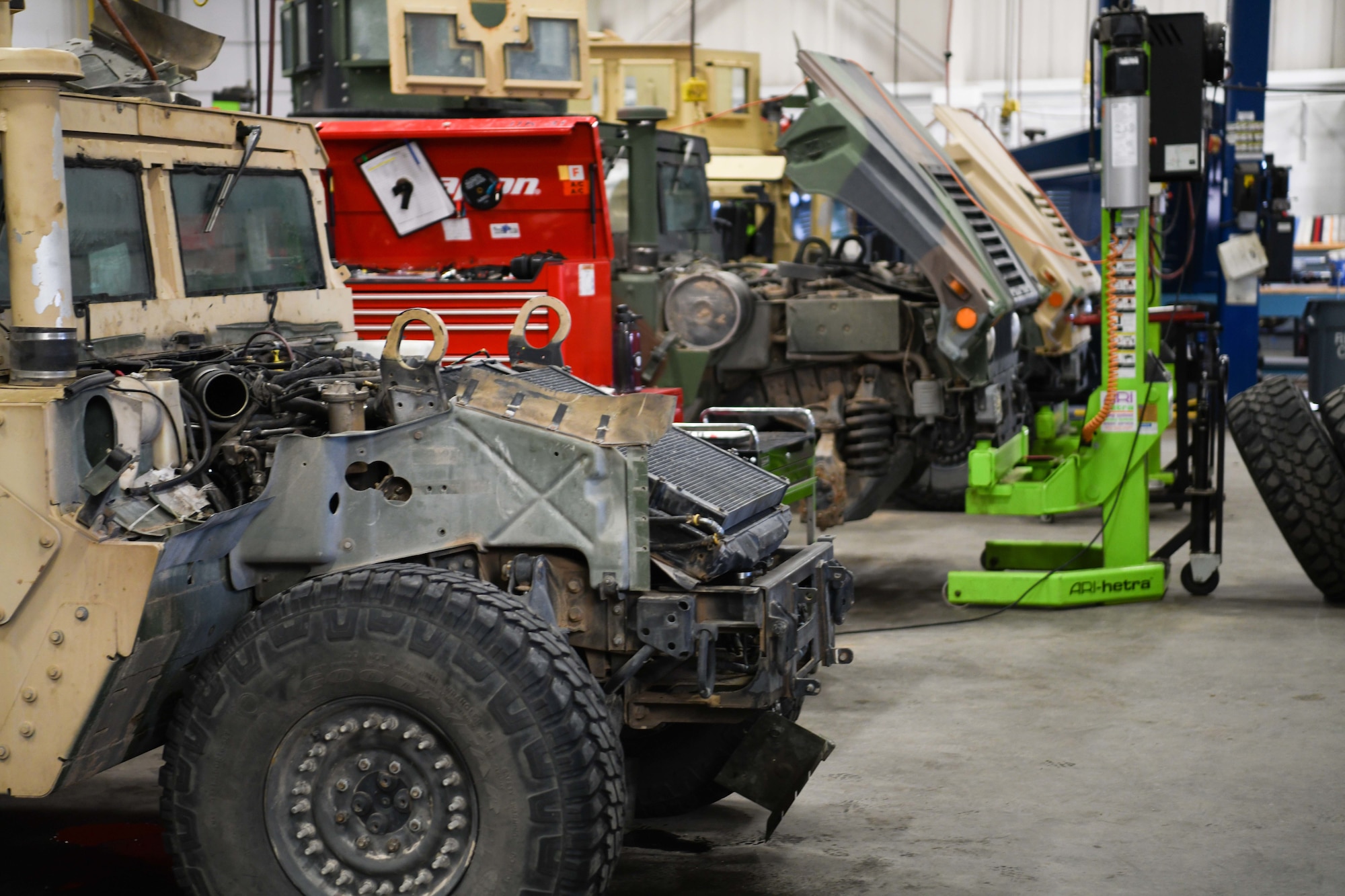 Humvees are parked in the 90 LRS Vehicle Maintenance Flight warehouse on F.E. Warren Air Force Base, Wyoming, Feb. 8, 2022. The Vehicle Maintenance Flight is responsible for maintaining and repairing vehicles used in the mission of strategic nuclear deterrence. (U.S. Air Force photo by Airman 1st Class Charles Munoz)