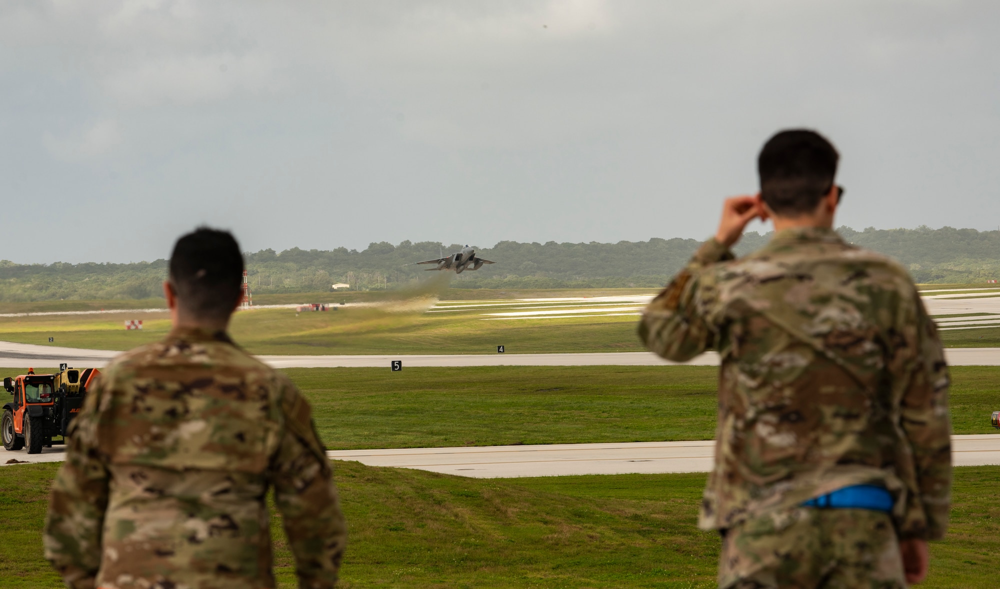 Members from Team Andersen watch a U.S. Air Force F-15C take off from Andersen Air Force Base, Guam, during a take-off viewing day for exercise Cope North 22, Feb. 9, 2022. Service members, their families and civic leaders were invited to the flight line to learn the importance of Cope North while observing aircraft capabilities.  Exercise Cope North is the U.S. Pacific Air Forces’ largest multilateral exercise and includes more than 2, 500 U.S. Airmen, Marines, and Sailors working alongside 1,000 combined Japan Air Self-Defense Force and Royal Australian Air Force counterparts.