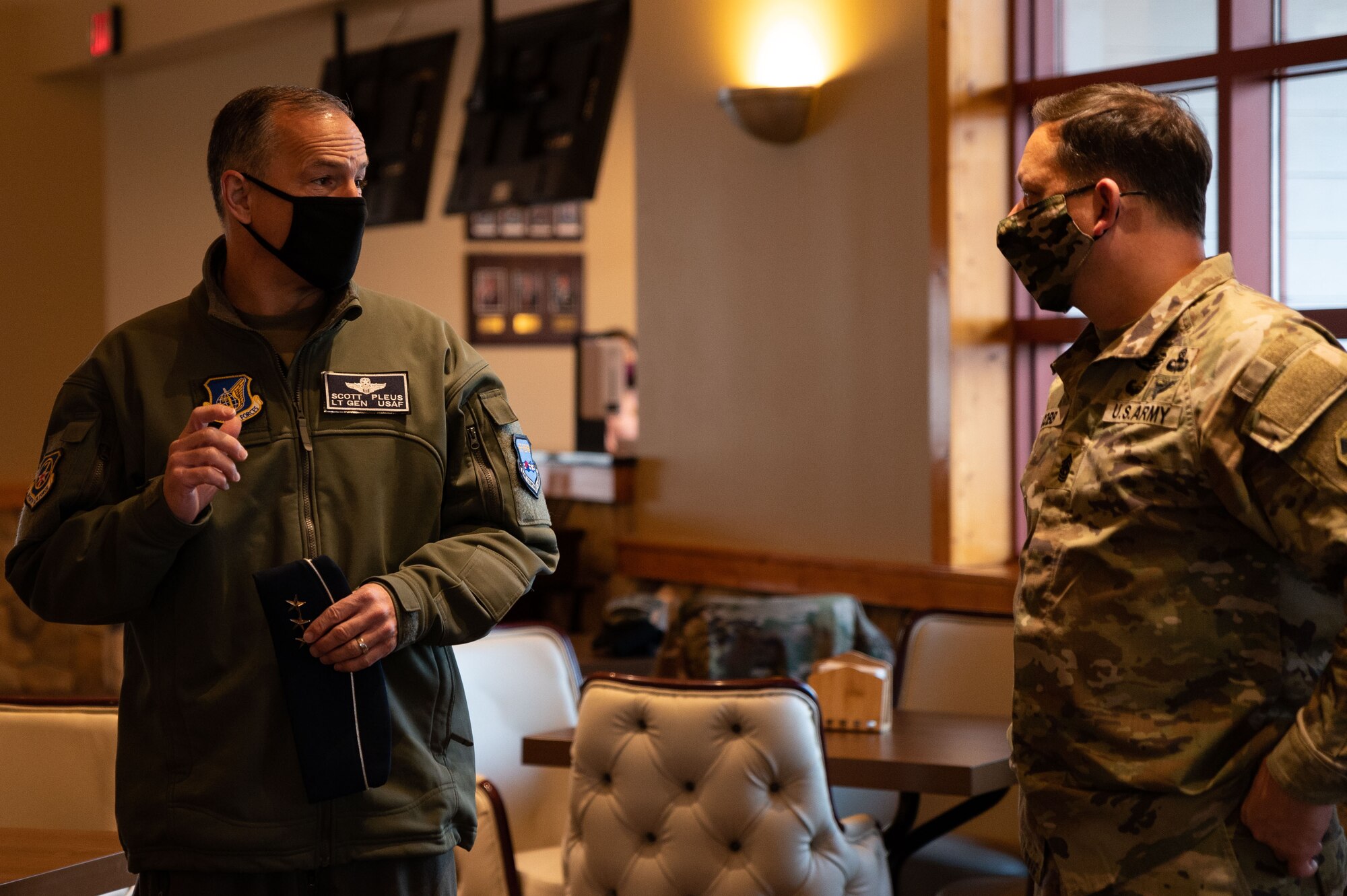 U.S. Air Force Lt. Gen. Scott Pleus, Seventh Air Force commander, greets Command Sgt. Maj. Robert Cobb, Eighth Army, during an Airpower Immersion Day at Osan Air Base, Republic of Korea, February 10, 2022. The event enabled leadership to see how multiple missions on base play a vital role in air component readiness. (U.S. Air Force photo by Senior Airman Megan Estrada)