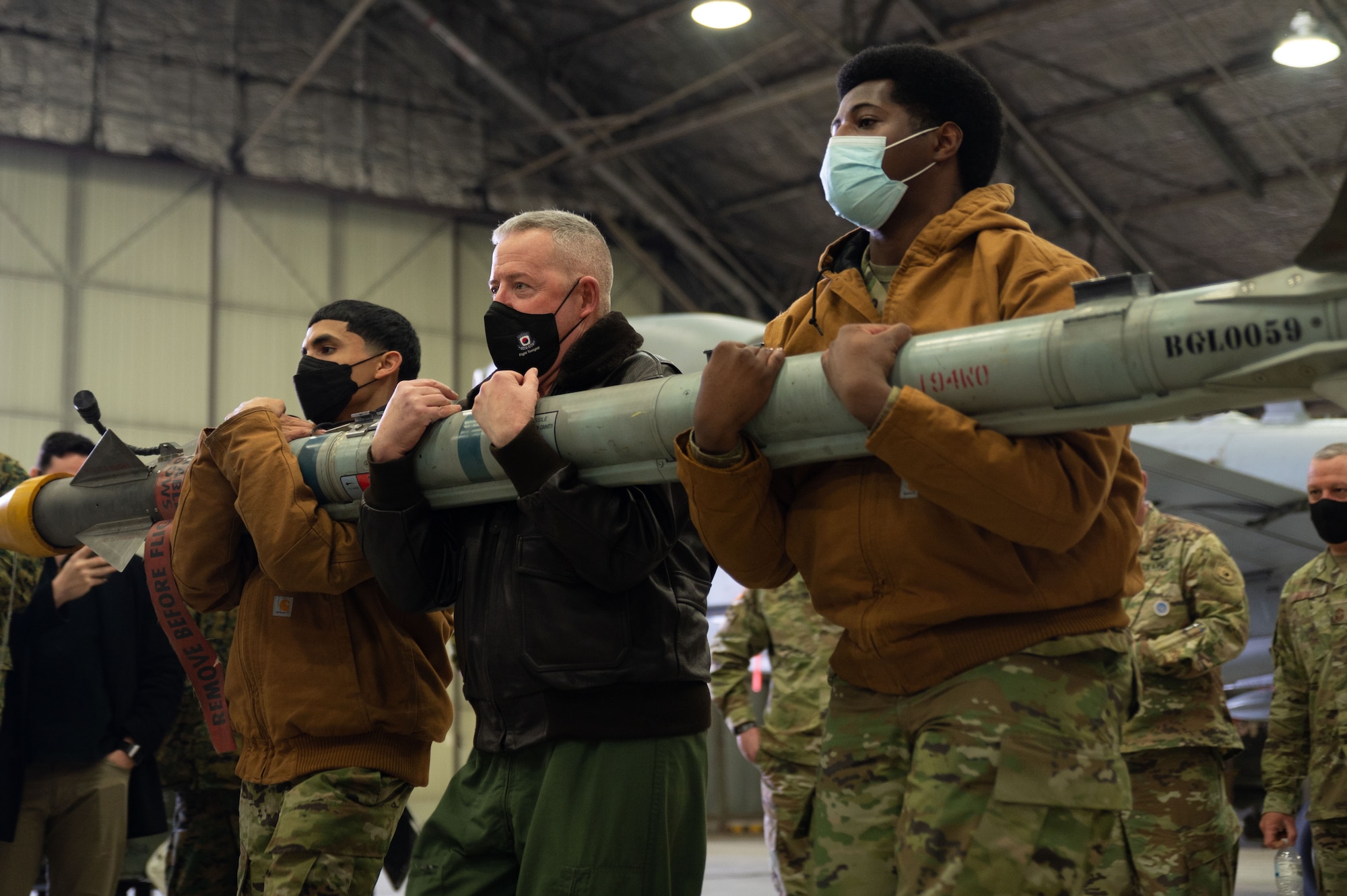 U.S. Marine Corps Maj. Gen. Bradley James, U.S. Marine Corps Forces Korea commander, lifts an air intercept missile during Airpower Immersion Day at Osan Air Base, Republic of Korea, February 11, 2022. He was one of 18 senior leaders stationed across Korea to attend the event. (U.S. Air Force photo by Senior Airman Megan Estrada)
