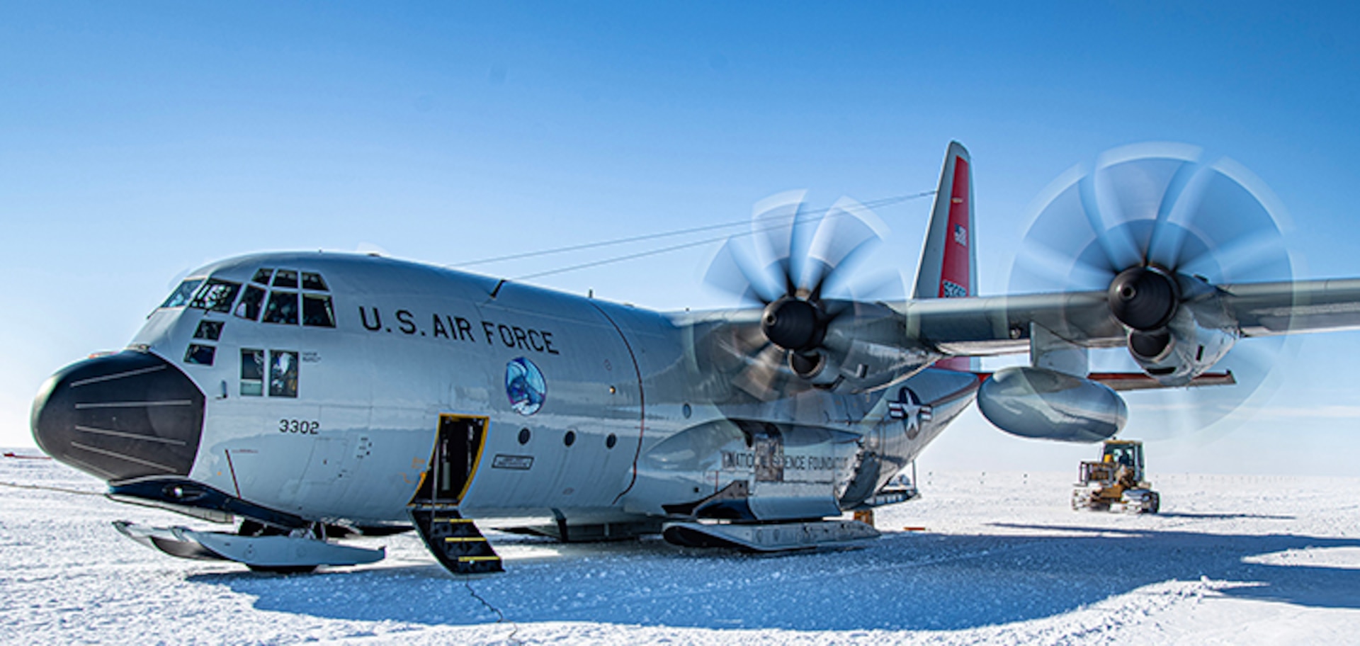 Airmen assigned to the 109th Airlift Wing, New York National Guard, prepare to unload cargo at a research station in Antarctica.